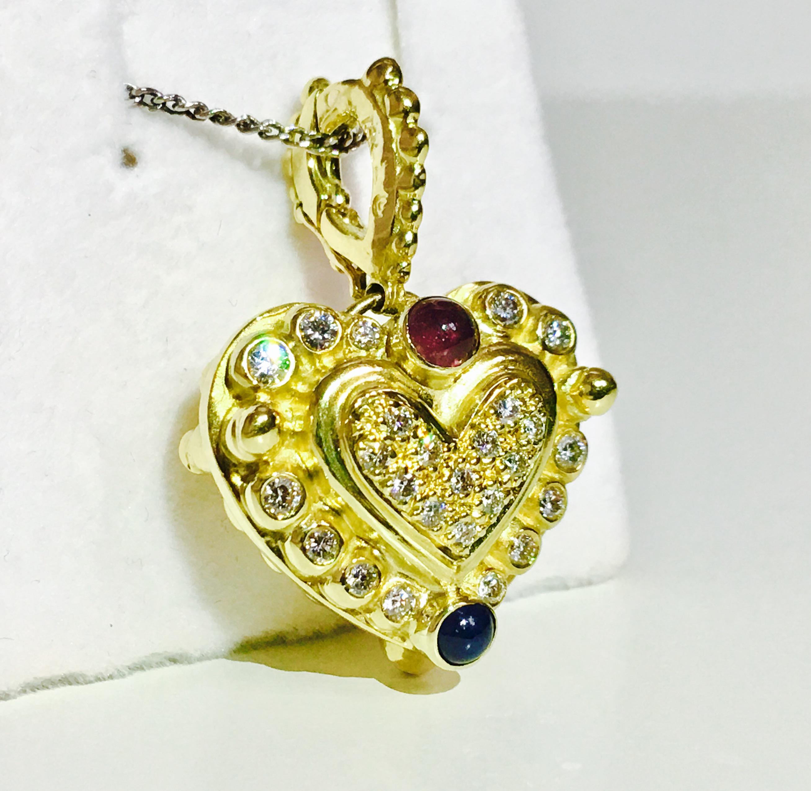 Metal: 18K yellow gold. 

0.75 Carat diamonds. VVS clarity and F color. 

0.50 carat total blue sapphire and ruby. Absolutely stunning pendant. 

16 grams (approx) total weight. Unique and vintage style heart pendant. Perfect for ladies. 

CHAIN NOT