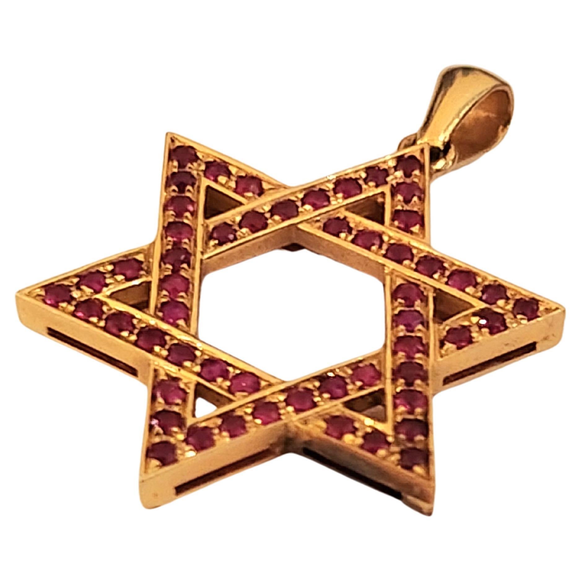 Vintage star of david pendant decorated with natural red rubies in excellent workmanship pendant in 14k yellow gold messures 3cm lenght total pendant weight 5 grams
