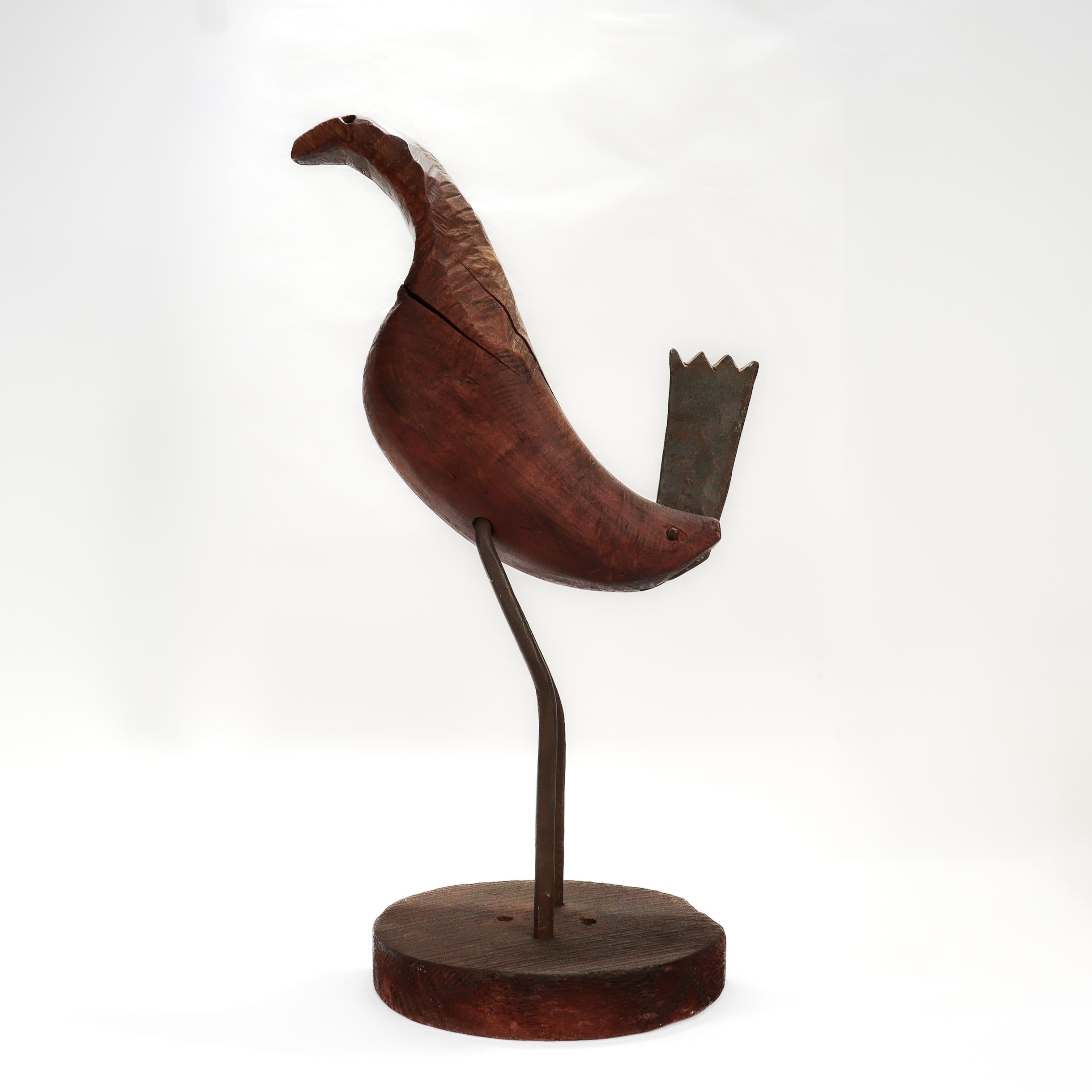 A fine signed folk art bird sculpture.

By Rudolph Condon. 

In carved wood and wrought iron. 

In the form of a bird atop a circular plinth. A near identical sculpture of Condon's was photographed by Fritz Goro for LIFE Magazine ca. 1956.

Condon