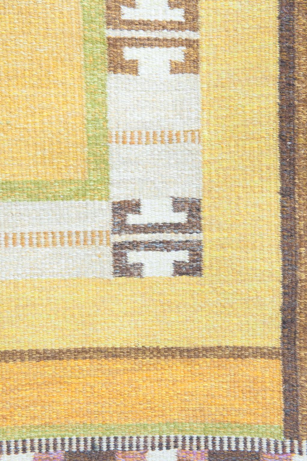 Beautiful vintage handwoven Røllakan, carpet of wool flat-weave with handwowen in a polychrome pattern. Signed IS. Signed IS by Ingegerd Silow (1916-2005). Made mid-1900.

This rug is never washed or cleaned.