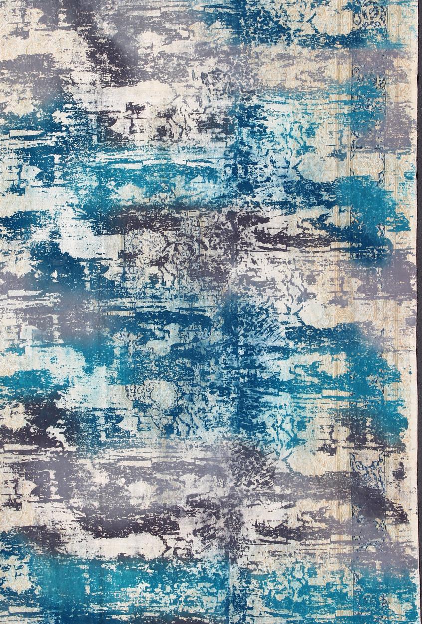 This Persian carpet with a classical composition has been overdyed in blue, gray, and charcoal. With both Classic and contemporary characteristics, this beautiful carpet could perfectly adorn a transitional or a contemporary room. Colors includes