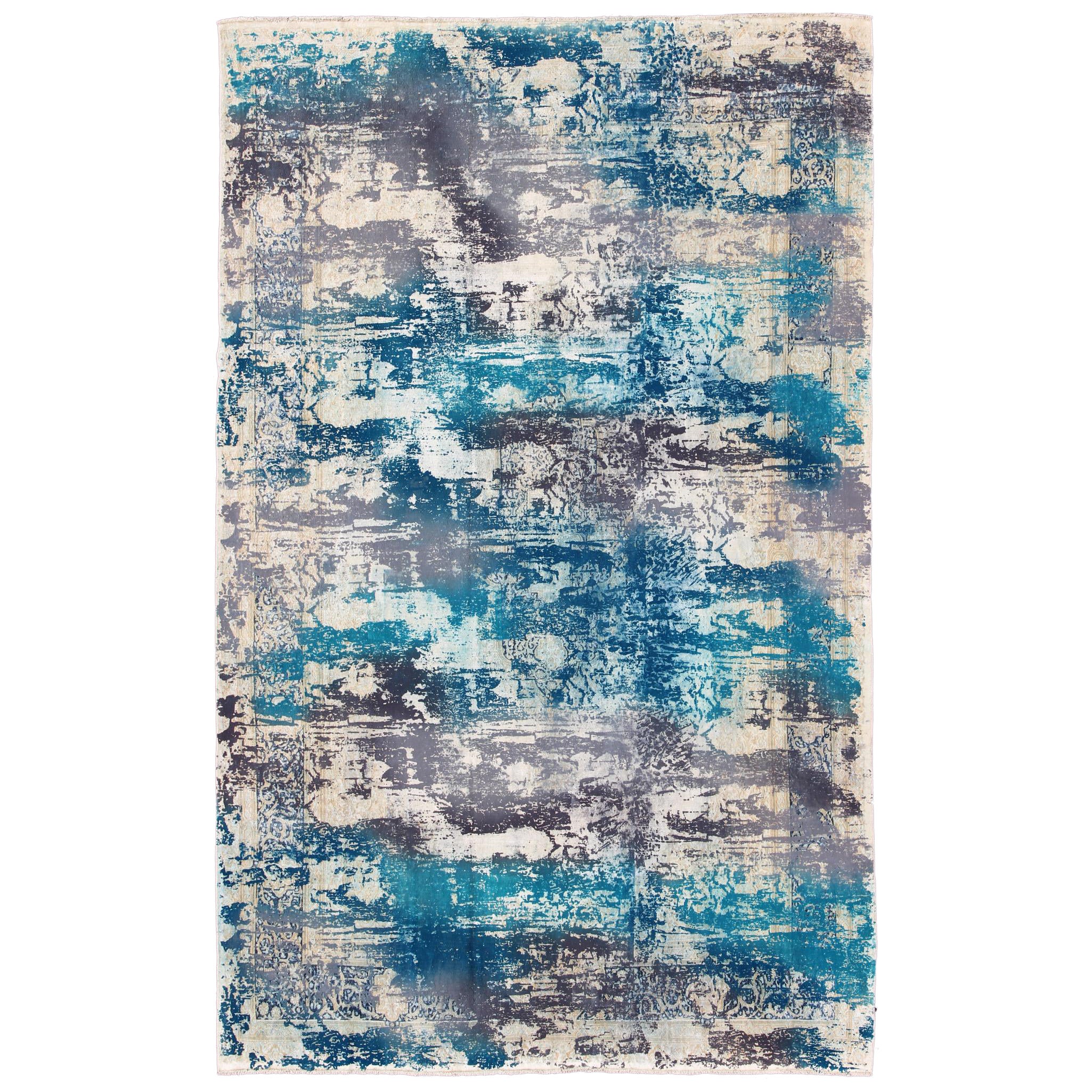 Tapis vintage au design moderne dans des tons de bleu, gris et ivoire