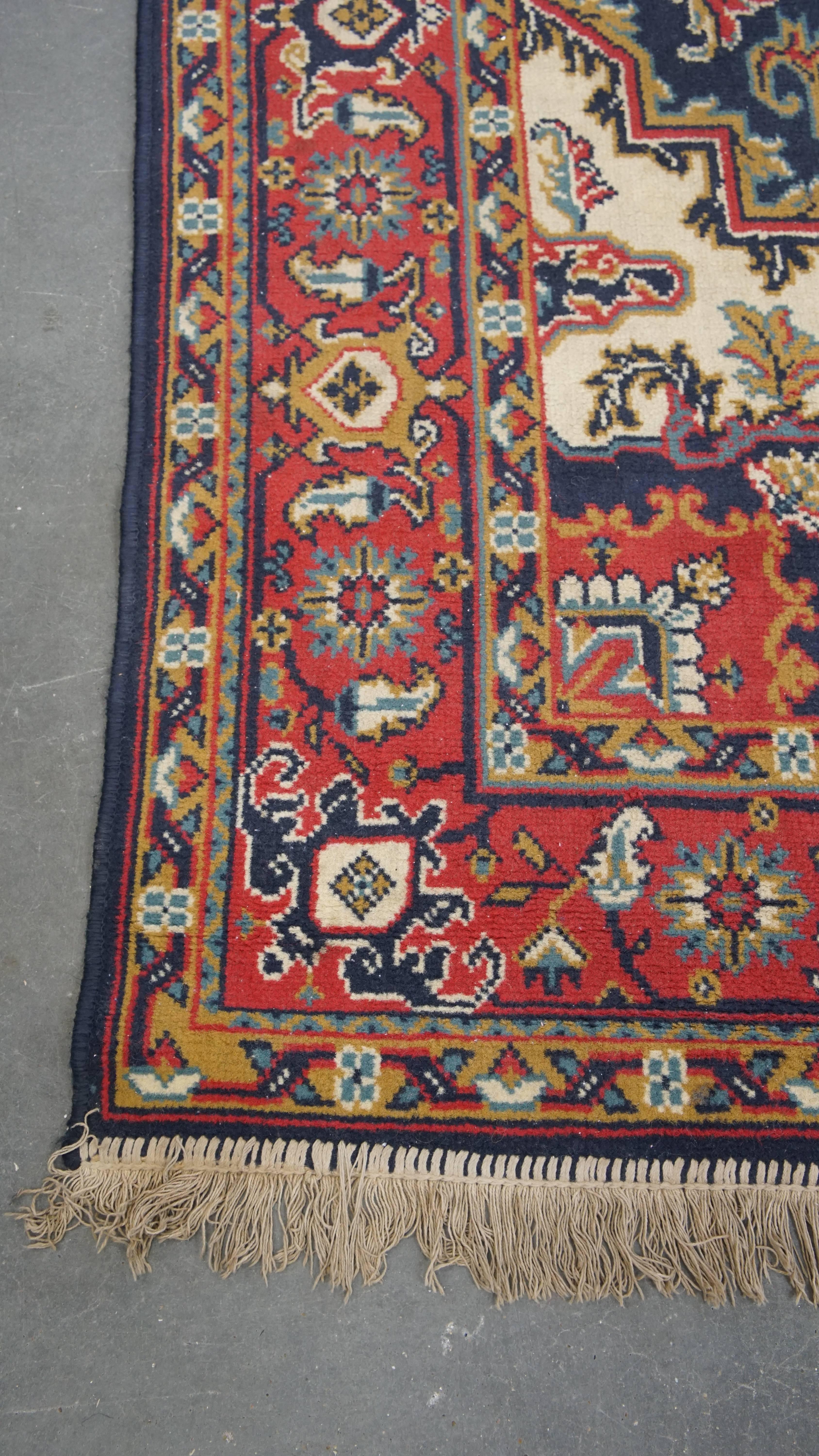Offered here is this vintage rug featuring predominantly red and dark blue tones with intricate patterns, measuring 236x170 cm.

Let your home shine with this stunning rug. It boasts beautiful colors and exquisite detailing. These kinds of rugs are