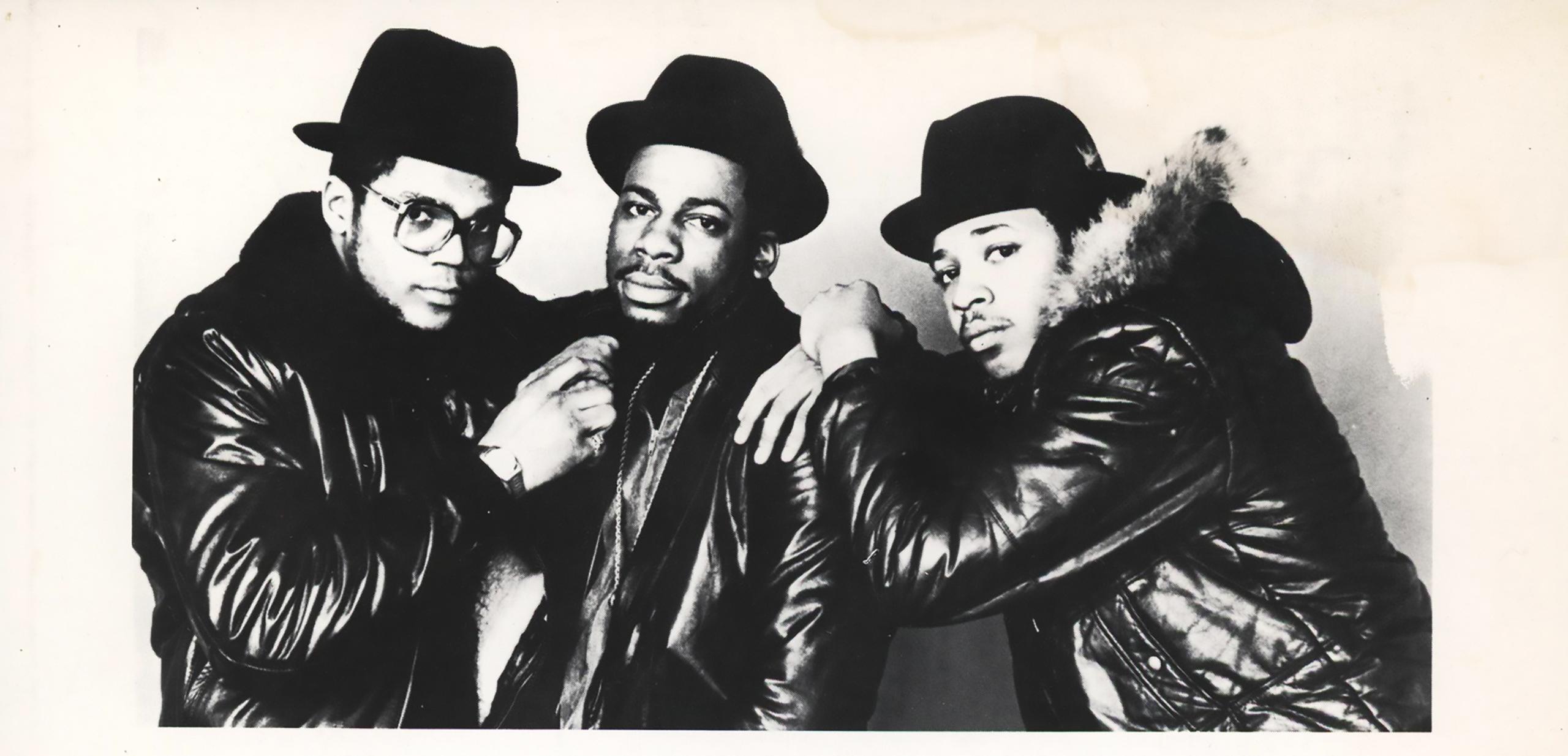 Vintage Run DMC Photograph (Run DMC Rushtown Management):
Rare vintage original Run DMC press/promotional photograph published by Rushtown Management. Circa early 1980's.

Dimensions: 4 x 8.5 inches. 
Fair overall vintage condition; contains