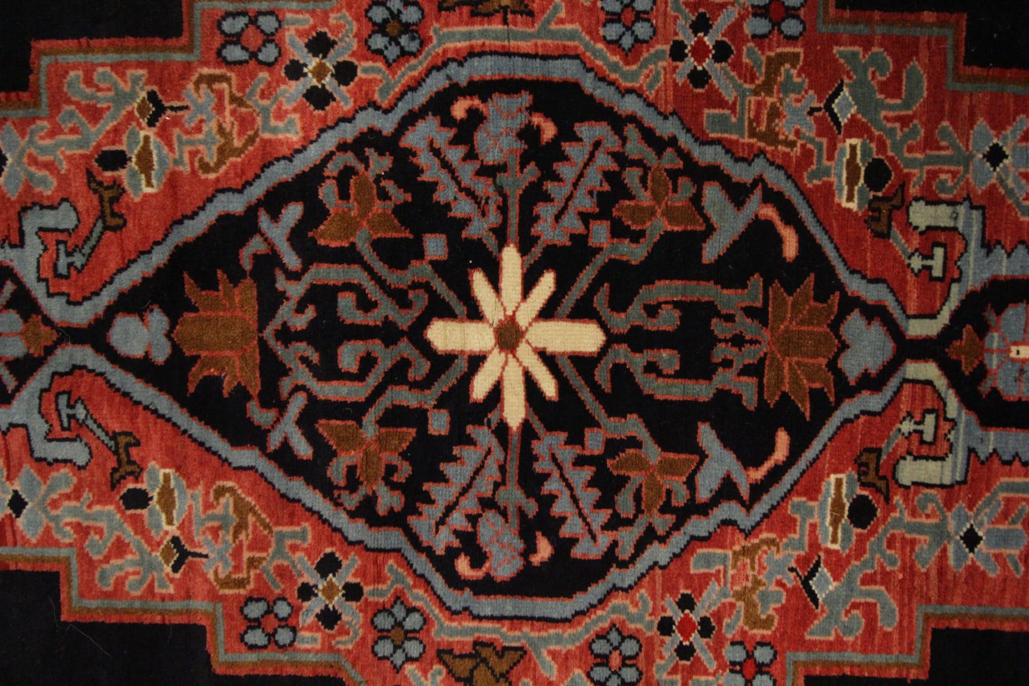 A stunning vintage Caucasian runner rug that seamlessly blends traditional design elements with captivating motifs. Adorned with a central medallion surrounded by intricate patterns and a charming repeating border, this rug embodies the rich