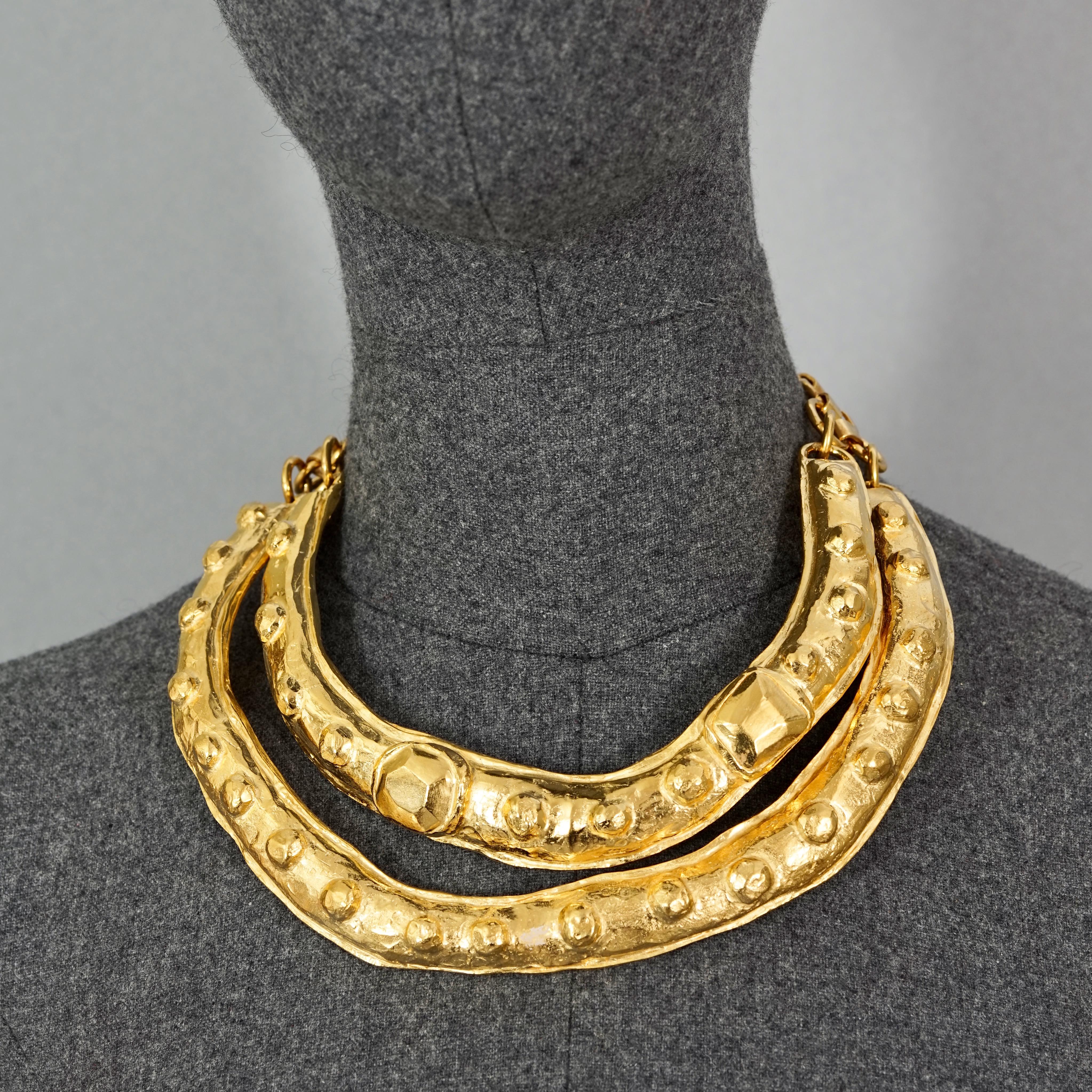 Vintage Runway CHRISTIAN LACROIX Double Layer Masai Rigid Gold Necklace

Measurements:
Height: 1.57 inches (4 cm)
Inner Circumference 12.99 inches (33 cm) 
Chain Extender: 5.90 inches (15 cm)

Features:
- 100% Authentic CHRISTIAN LACROIX.
- 2 layer