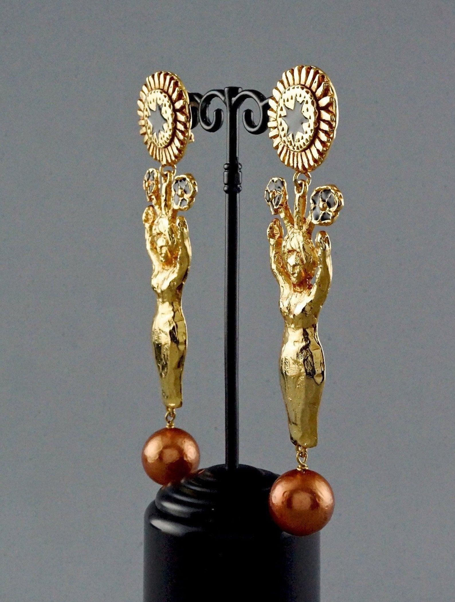 Vintage Runway CHRISTIAN LACROIX Sculptured Figural Woman Enamel Pearl Earrings

Measurements:
Height: 4.92 inches (12.5 cm)
Width: 1.29 inches (3.3 cm)
Weight per Earring: 36 grams

Features:
- 100% Authentic CHRISTIAN LACROIX.
- 3 dimensional
