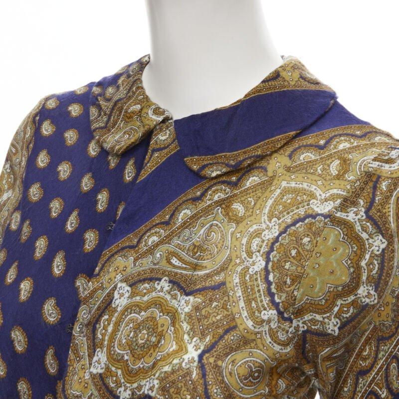vintage Runway COMME DES GARCONS 1993 blue paisley peter pan collar shirt M
Reference: CRTI/A00402
Brand: Comme Des Garcons
Designer: Rei Kawakubo
Collection: 1993 - Runway
Material: Acrylic
Color: Blue, Gold
Pattern: Paisley
Closure: Hook &