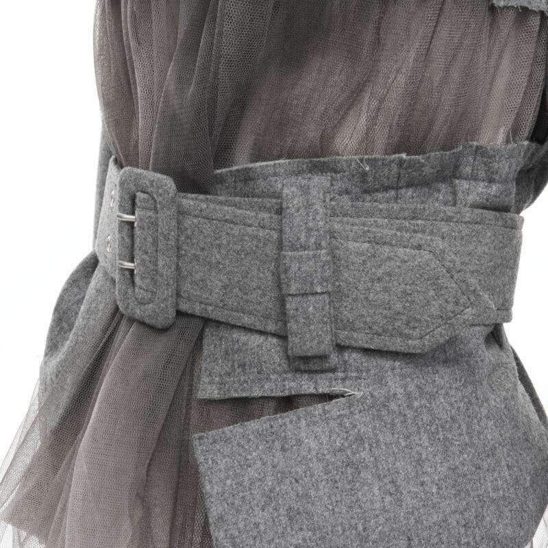 vintage Runway COMME DES GARCONS 2006 grey tulle belted deconstructed jacket XS
Reference: CRTI/A00321
Brand: Comme Des Garcons
Designer: Rei Kawakubo
Collection: 2006 - Runway
Material: Wool
Color: Grey
Pattern: Solid
Closure: Belt
Made in: