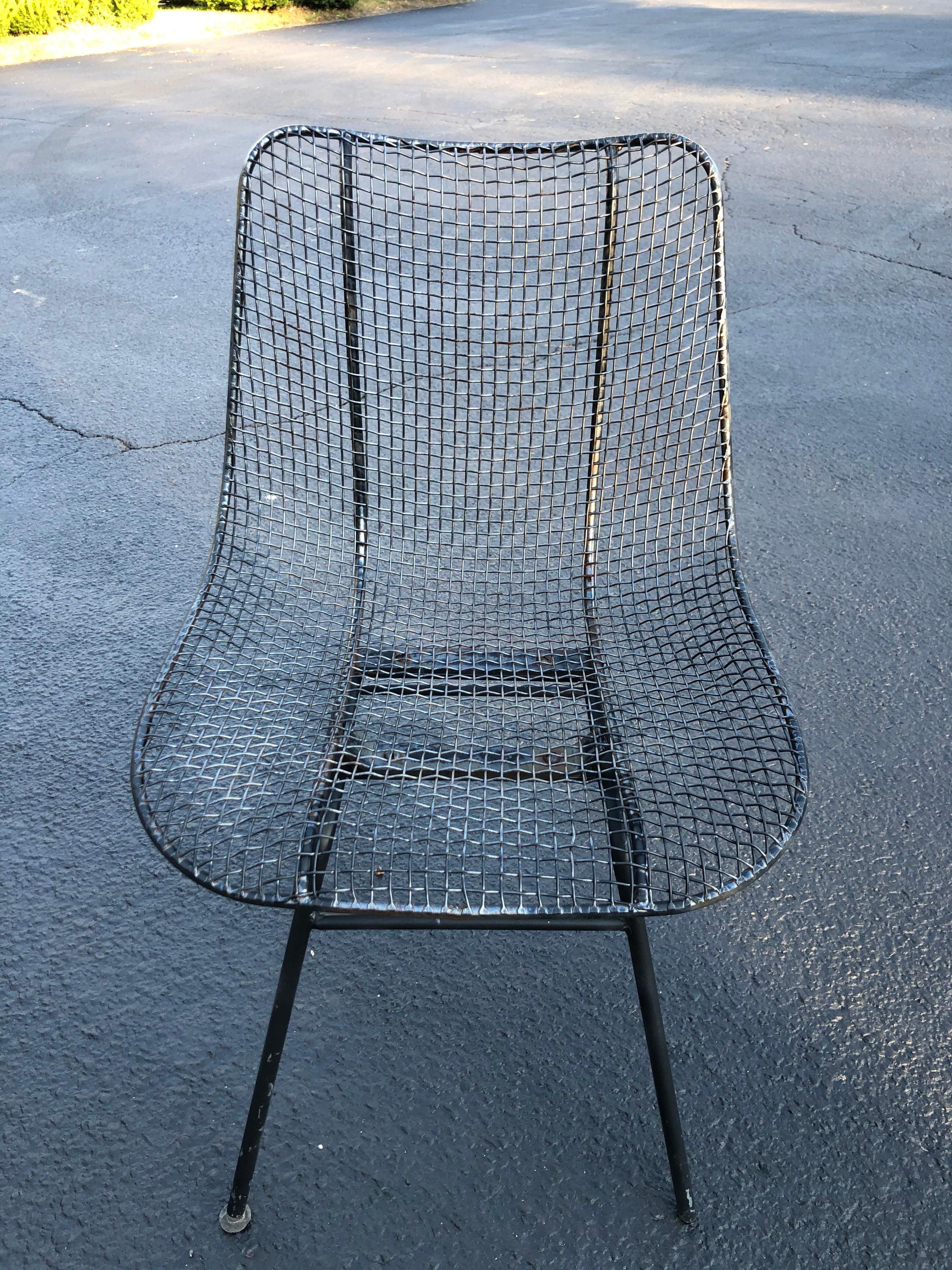 Vintage John Woodard sculptura metal mesh sculptura chair. Black finish, some rust, but it can be repainted in any color. Missing two glides on feet. Could be ordered on line. We can parcel ship this very economically. Please  inquire about that