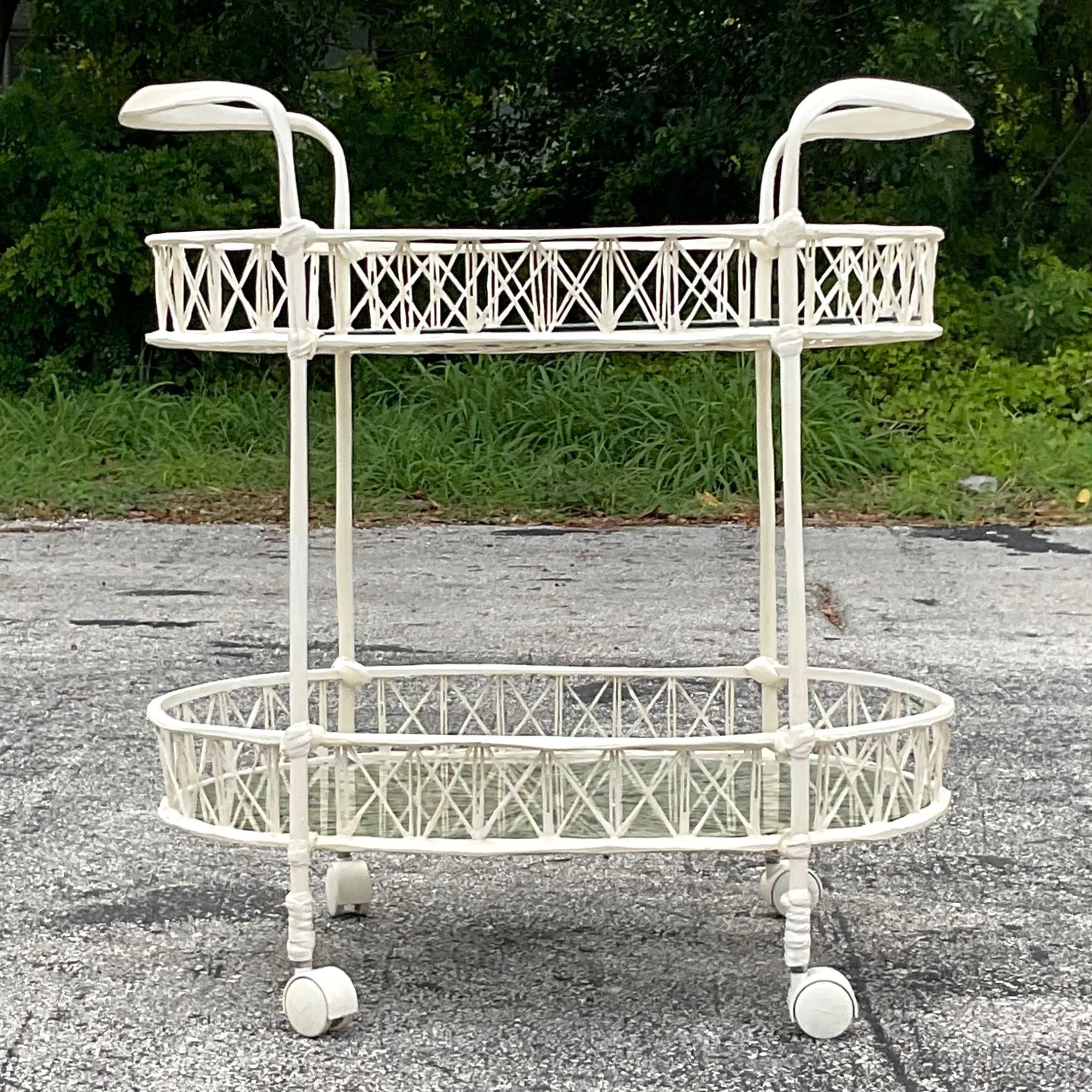 A fabulous vintage MCM outdoor bar cart. Made from spun fiberglass with inset glass shelves. A terrific material for outdoors, but chic enough to bring indoors as well. Made by the iconic Russell Woodard. Acquired from a Palm Beach estate.
