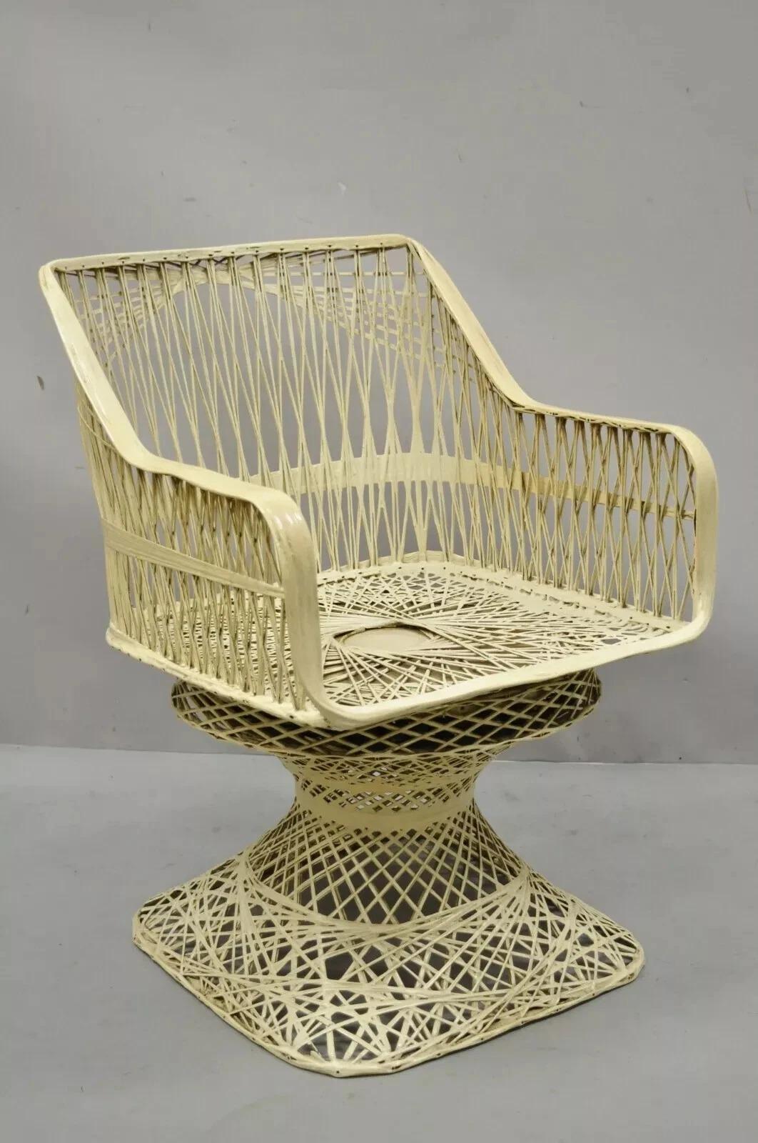 Vintage Russell Woodard Woven Spun Fiberglass Armchair. Item features a swivel seat, pedestal base, woven fiberglass construction, great style and form. Circa Mid 20th Century. Measurements: 29.5