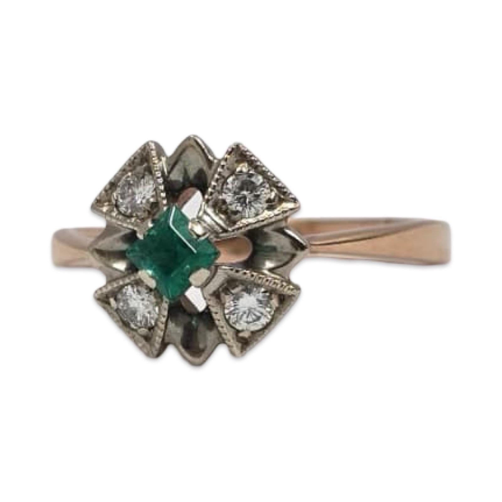 A striking vintage Russian ring crafted in solid fourteen-karat rose and white gold. At its center rests a vivid square-cut emerald measuring about 3.4 millimeters, framed by four round brilliant diamonds approximately 2.7 millimeters each. The