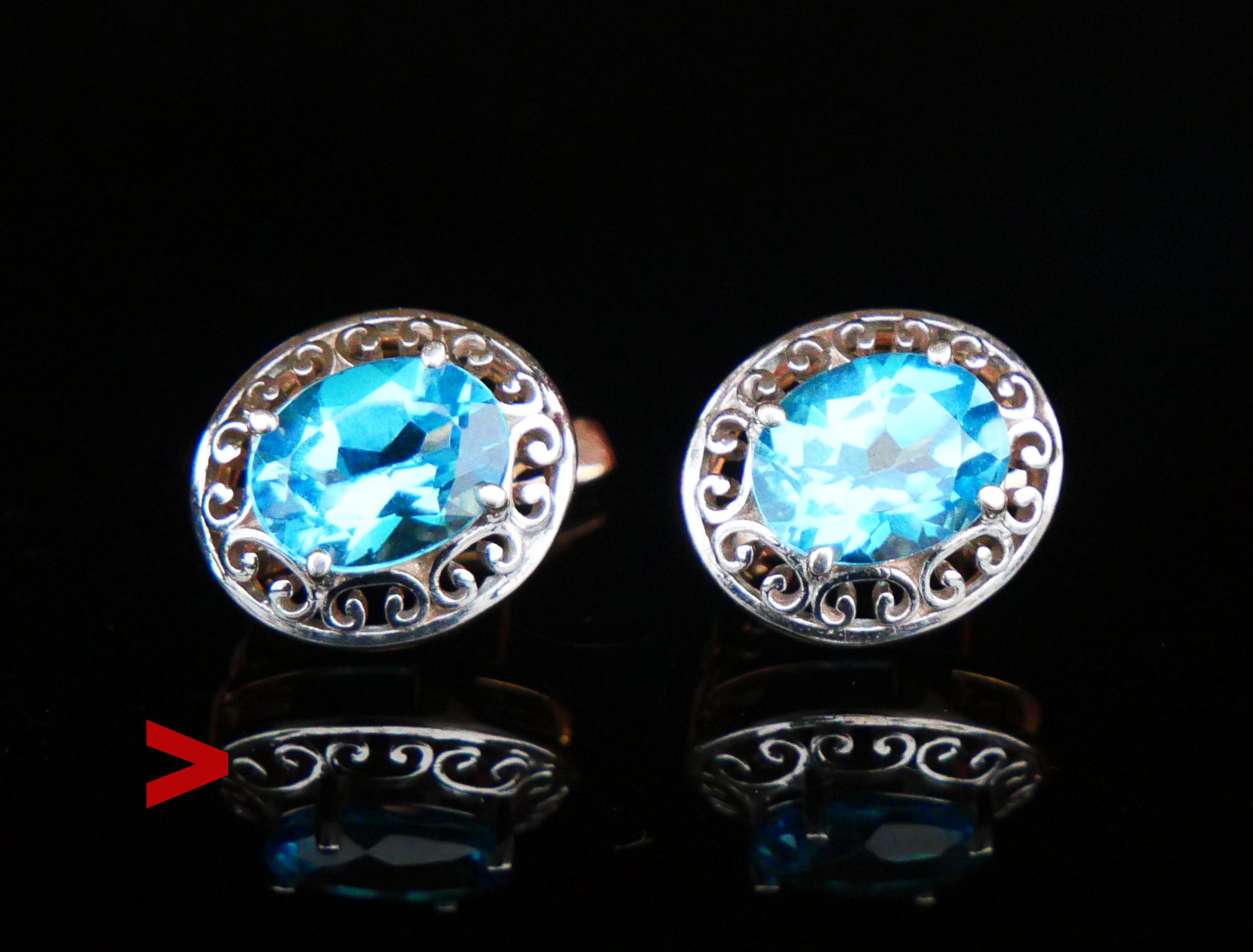 A pair of Russian Soviet period Huggies Earrings in solid 14K Rose Gold with lining in 14K White Gold holding oval cut Topaz settings 9mm x 7 mm /ca. 2ct each.

Each earring is marked with late Soviet Union period Russian 583 and maker's