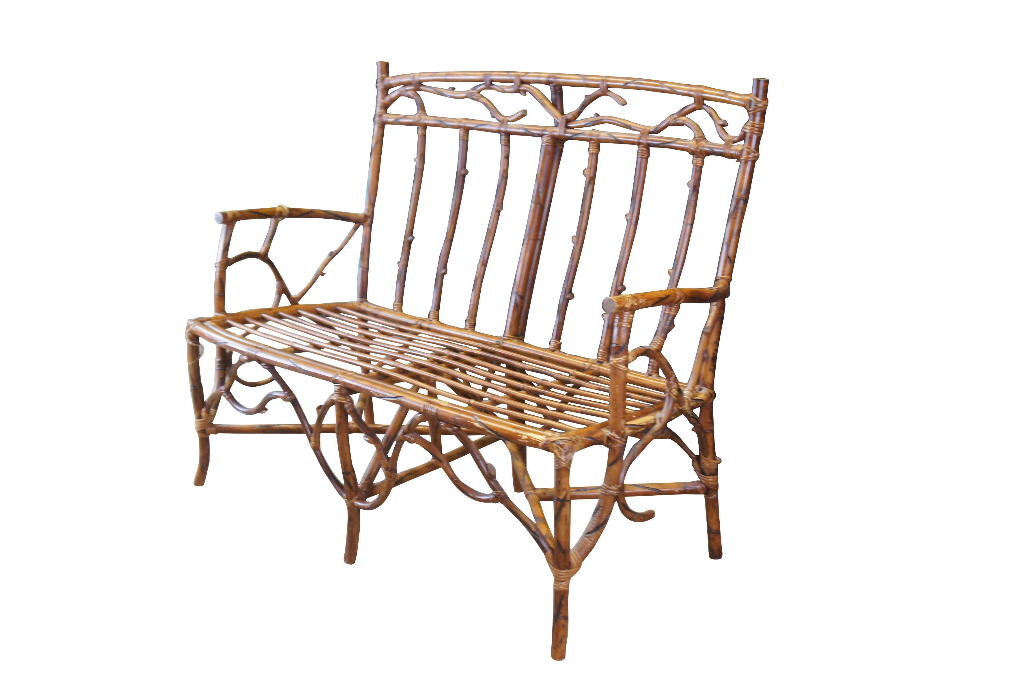 Vintage rustic log cabin / farmhouse / adirondak / tree branch style bench or settee.  Made of bamboo and rattan featuring bentwood style and slatted back.

Dimensions:
40