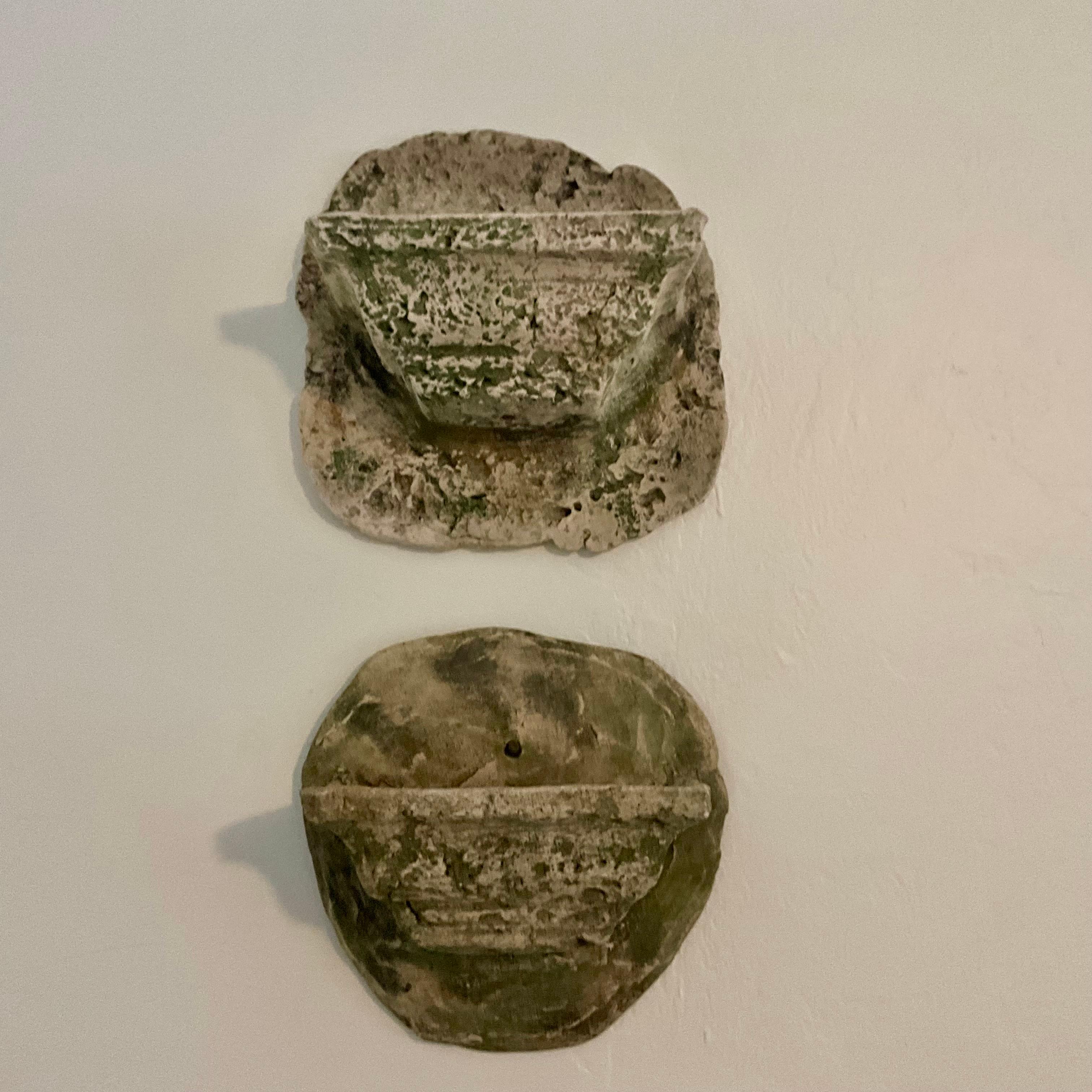 Vintage Rustic Cast Stone Cement Wall Planters - Indoor/Outdoor Collection from Florida Estate

This charming pair of vintage cast stone cement wall planters is perfect for indoor or outdoor use. Featuring a weathered finish, these planters add