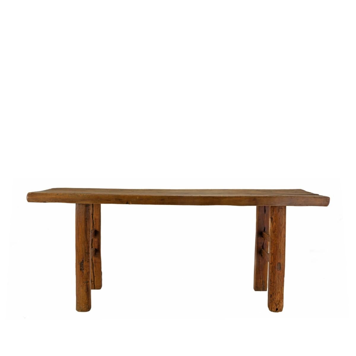 A rustic console table made of reclaimed wood, circa 1990. 

Dimensions: 74 inches L x 16.2 inches D x 31.2 inches H.
