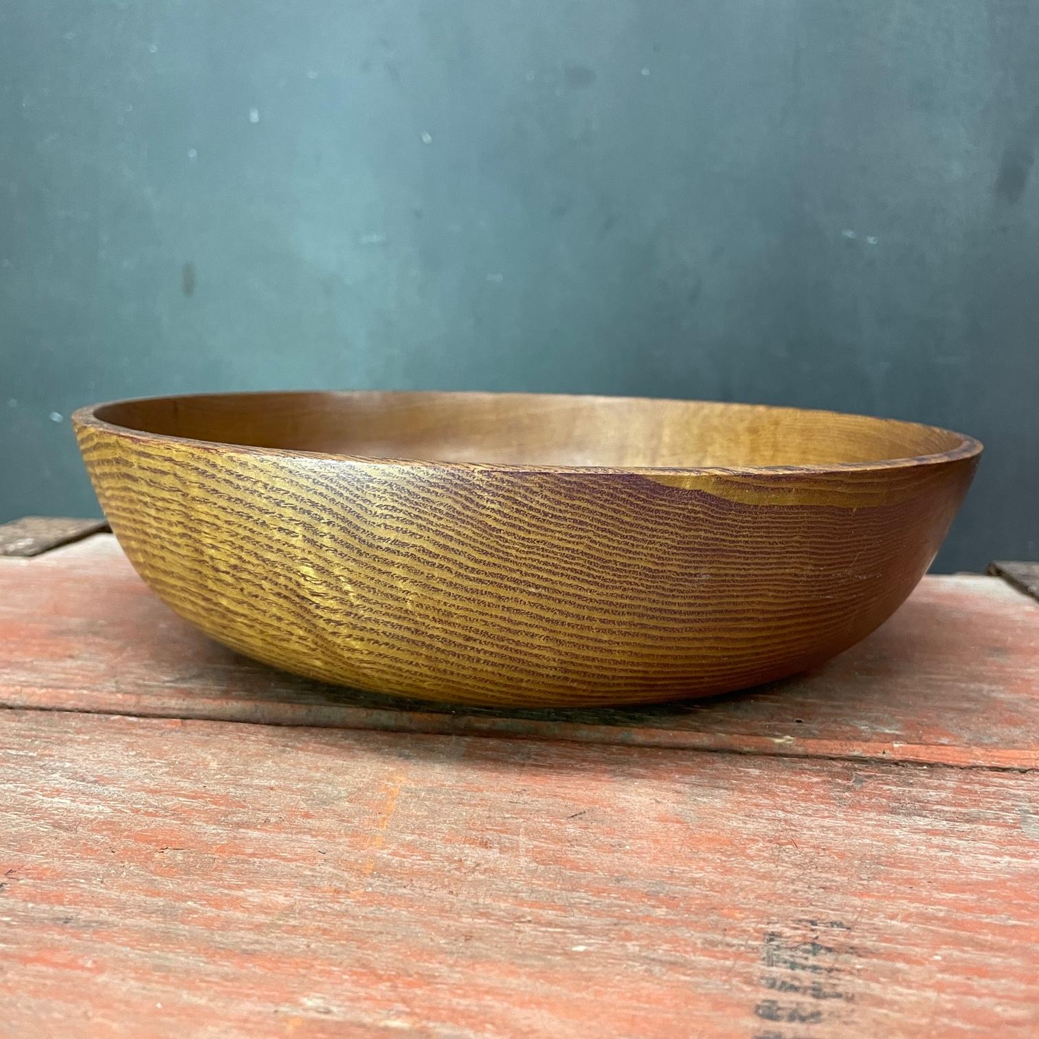 Wonderfully precise turned wood bowl, understated centerpiece or fruit bowl. Simple almost organic form. 10 inch diameter. No makers markings.
