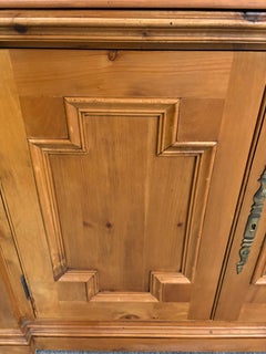 Vintage rustic scrubbed pine neoclassical style cabinet