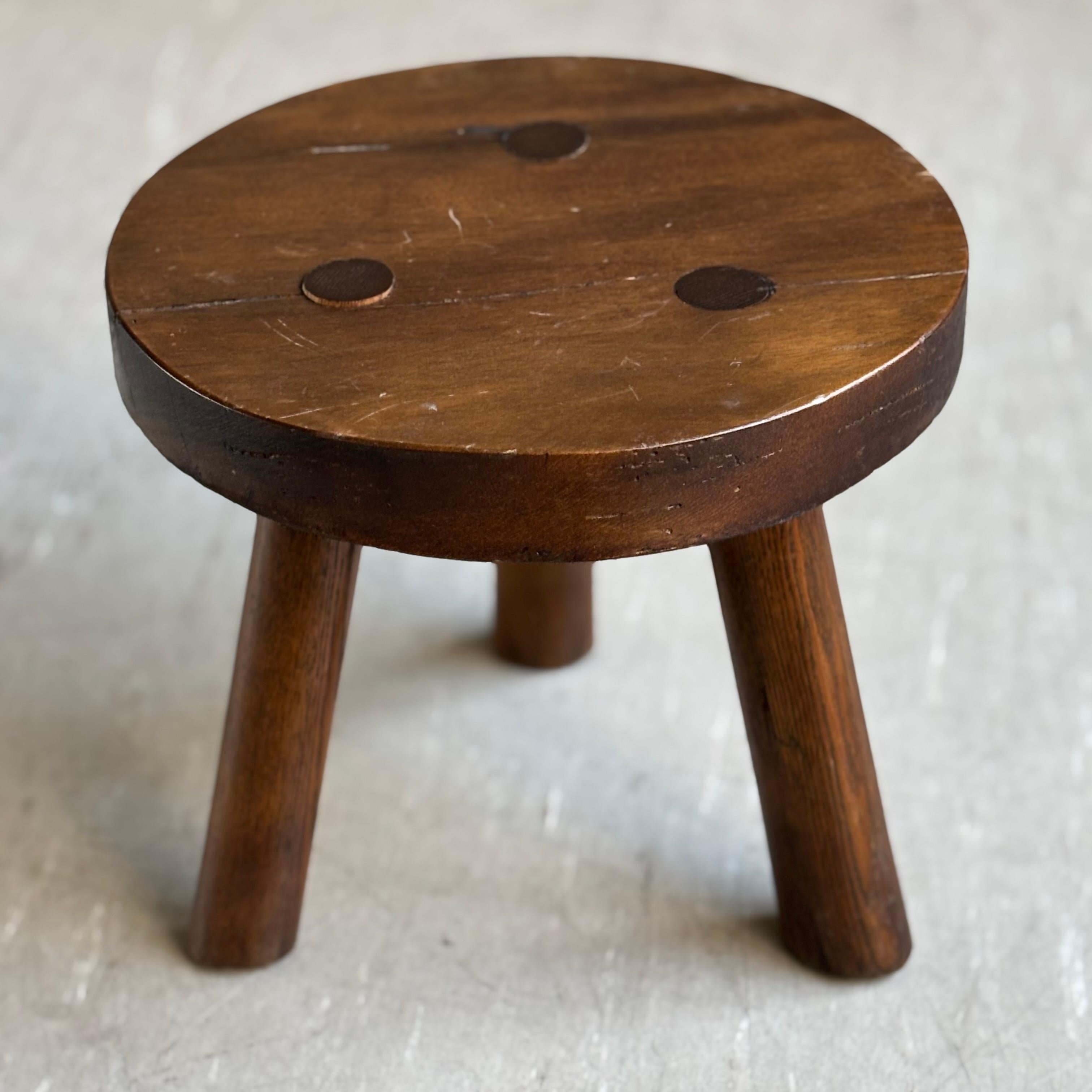 Vintage Rustic Tripod Milking Stool. Attributed to Charlotte Perriand (unconfirmed). Solid wood seat and tripod base. With light patination to the wood and minor signs of use as to be expected (see images). Completely stable structure and lends