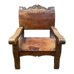 Fauteuil trône colonial espagnol rustique vintage en cuir et acajou