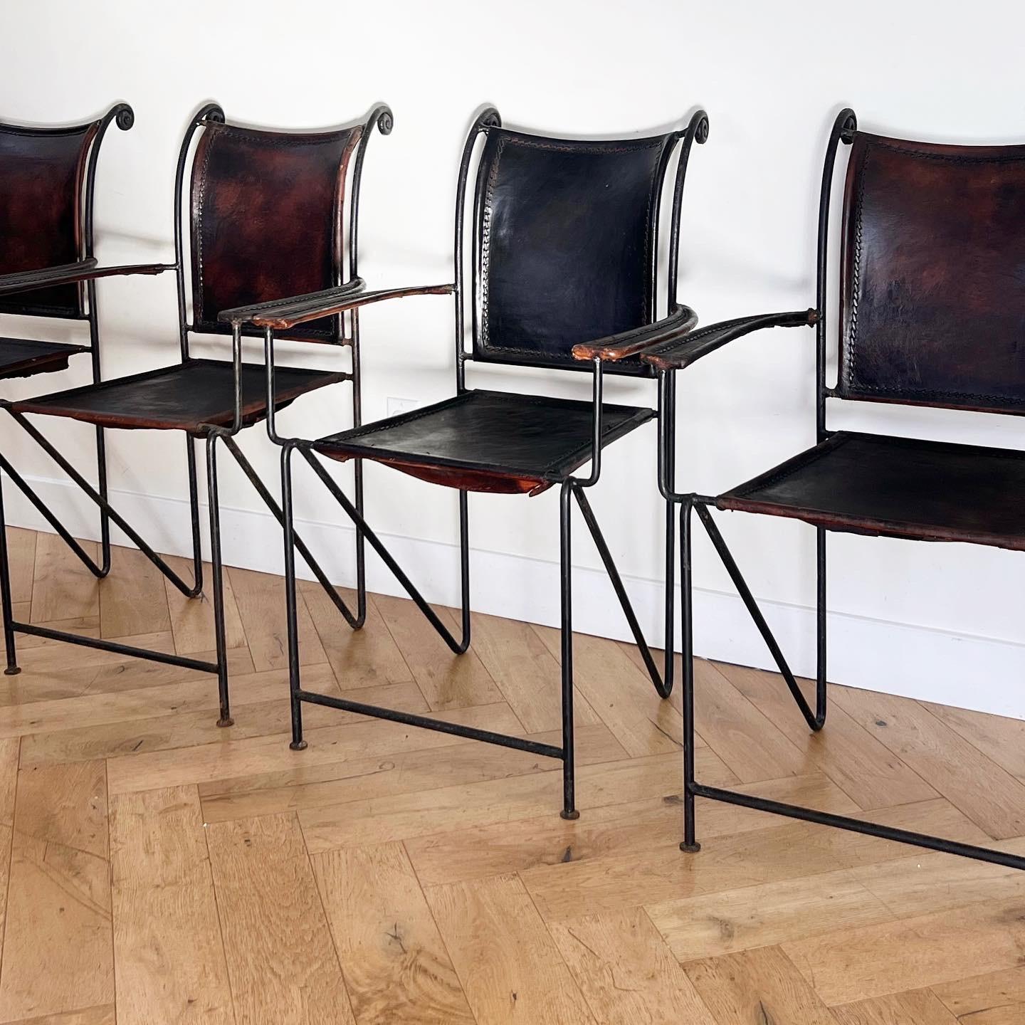 GOTHTIQUE: a 4set of wrought iron and leather antique Spanish gothic chairs, early to mid 20th century. These chairs are particularly unique due to their Z frames - dare I say a harbinger of postmodern sensibilities? Patina galore, including some