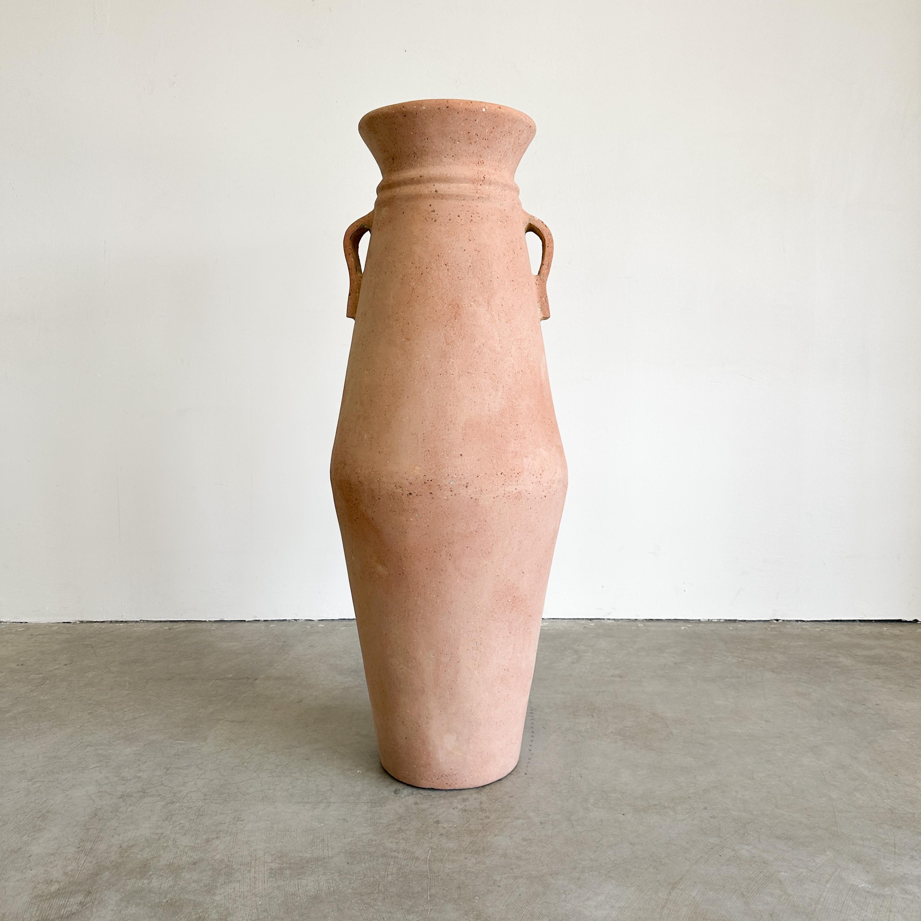 Enhance your space with this stunning vintage terracotta floor vase from the 1980s, featuring artisan craftsmanship and a striking rustic design. The extra-large vessel is ideal for adding a warm, earthy touch to your home decor, with its two looped