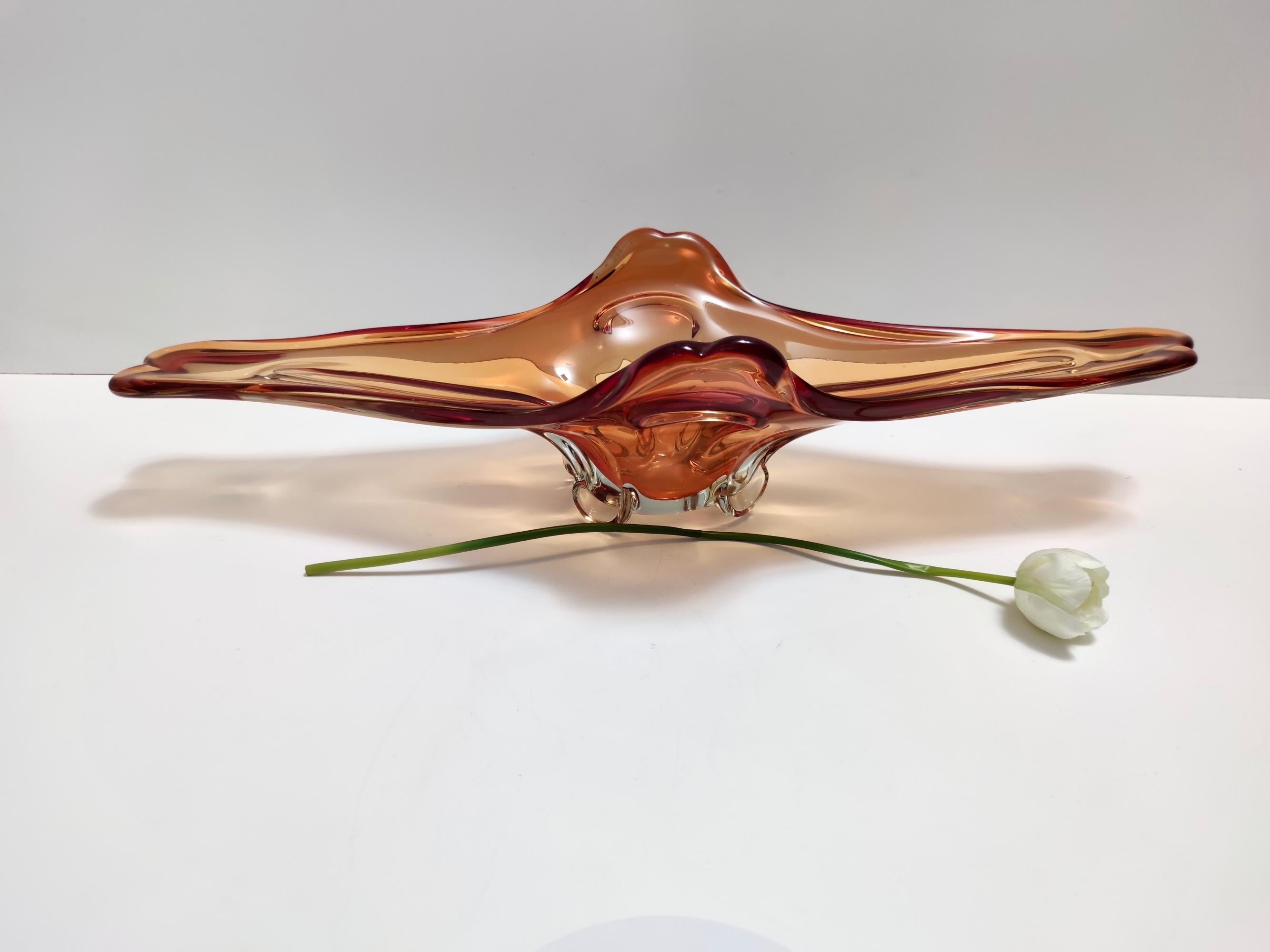 Made in Italy, 1950s - 1960s. 
This large bowl / centerpiece / vide-poche is made burnt orange sommerso Murano glass that has been hand-modeled. 
It is quite rare considering its measures.
This is a vintage piece, therefore it might show slight