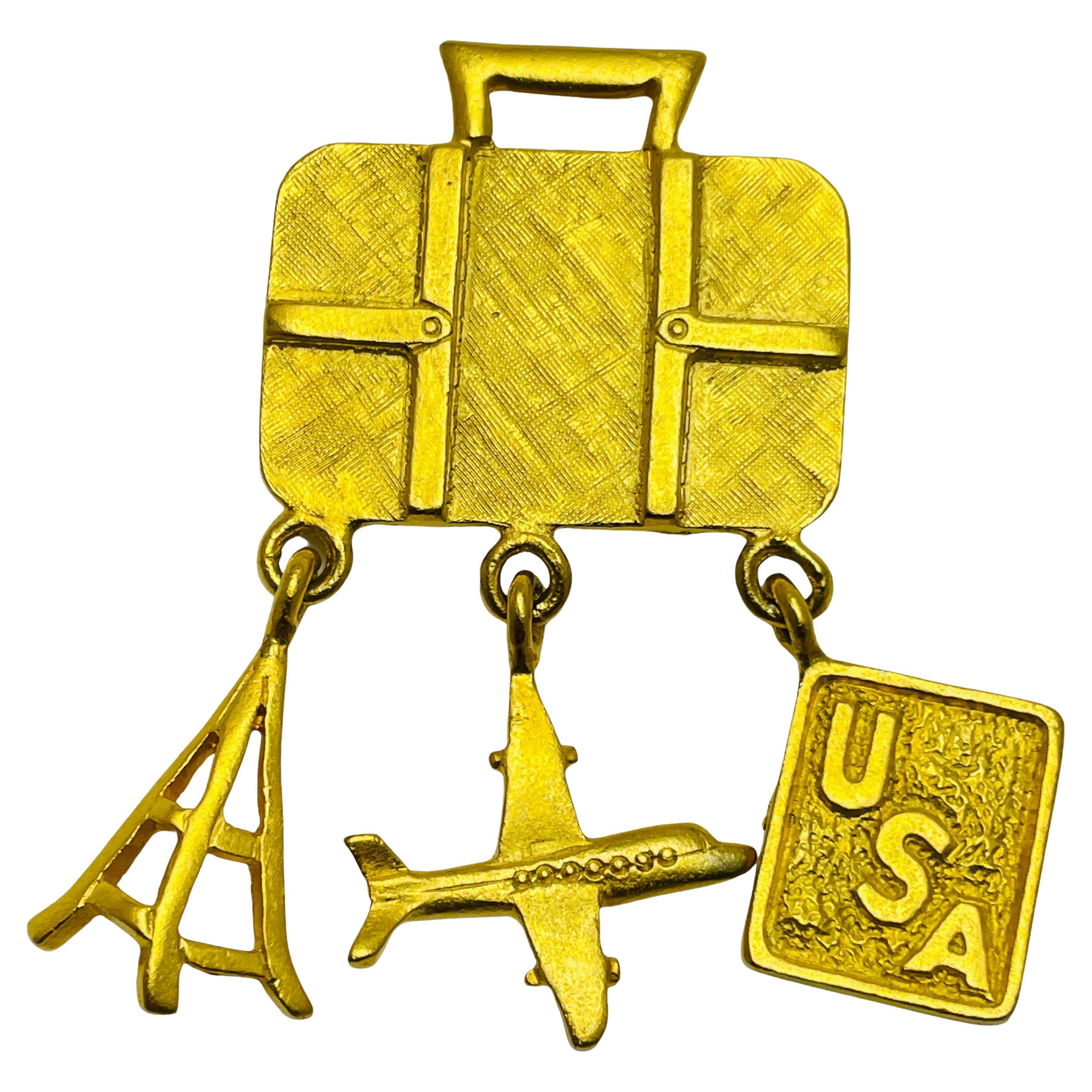 Vintage RVP signed gold tone travel plane luggage USA designer dangle brooch For Sale