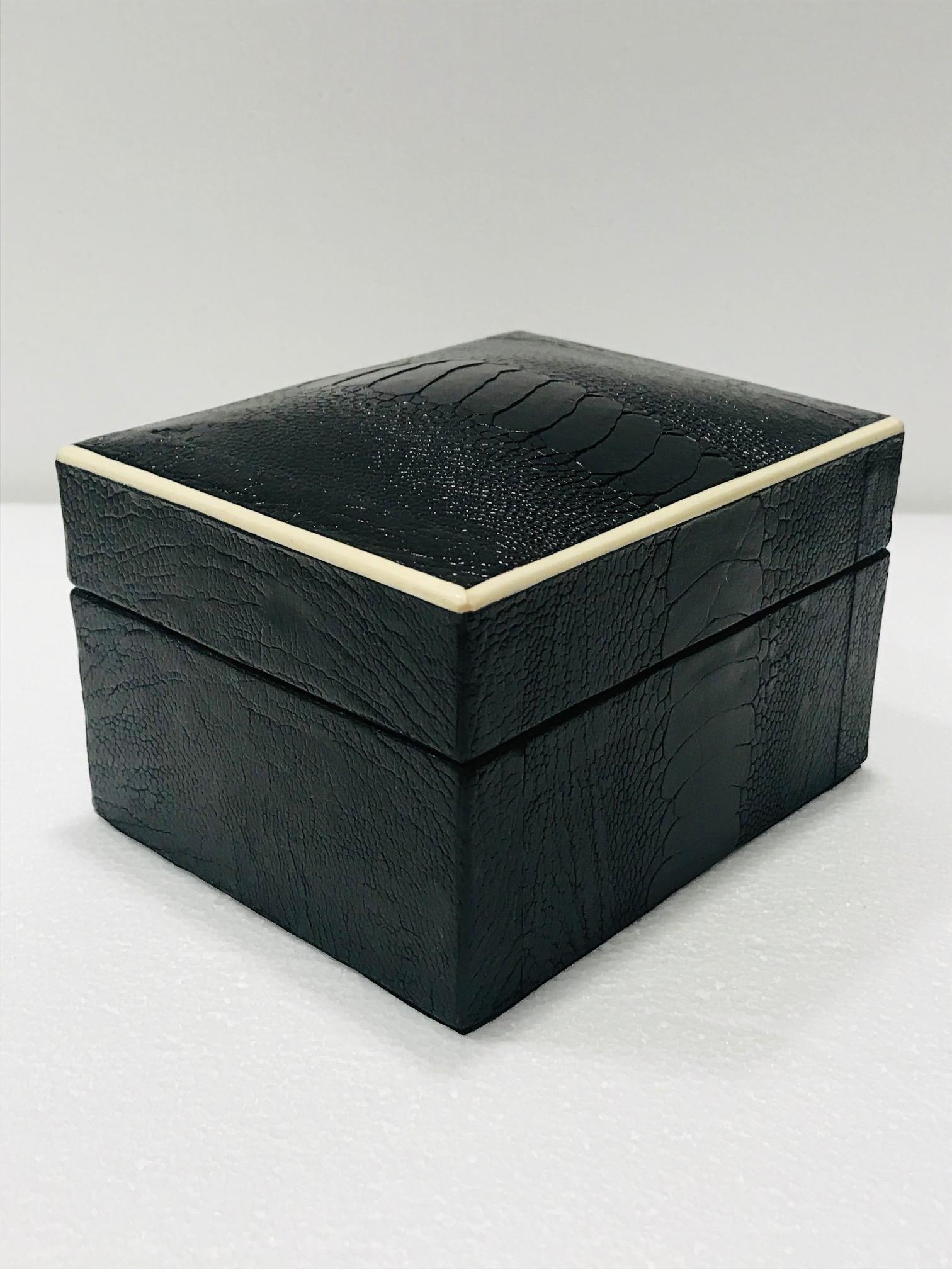 Organic modern decorative box wrapped in exotic ostrich leather with bone inlay detail. All handcrafted in hand-dyed black leather with palmwood interior. Great desk or coffee table accessory. Signed R&Y Augousti on the underside. Box also available