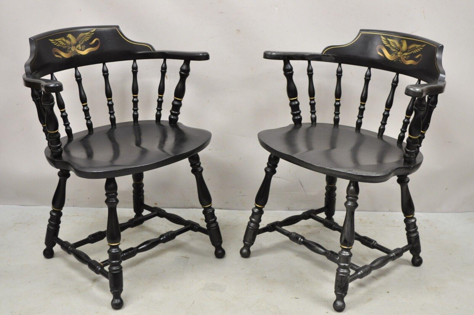 Vintage S. Bent & Bros black painted eagle colonial pub style chairs - a pair. Item features a gold eagle to backrest, spindle backs, solid wood construction, original label, quality American craftsmanship, great style and form. circa Mid-20th