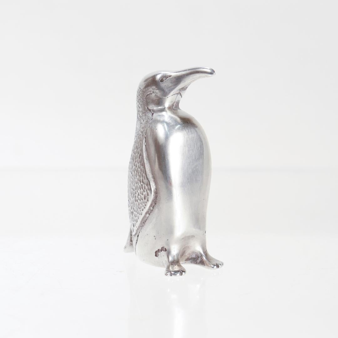 A fine vintage American silver figurine.

By Samuel Kirk & Son.

In sterling silver.

In the form of a penguin.

Marked to the base for for S. Kirk & Son / Sterling.

Simply a wonderful diminutive silver figurine!

Date:
20th Century

Overall