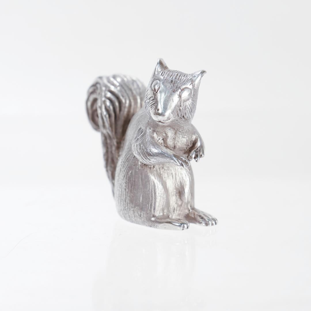 A fine vintage American silver figurine.

By Samuel Kirk & Son.

In sterling silver.

In the form of a seated squirrel.

Marked to the base for for S. Kirk & Son / Sterling.

Simply a wonderful diminutive silver figurine!

Date:
20th