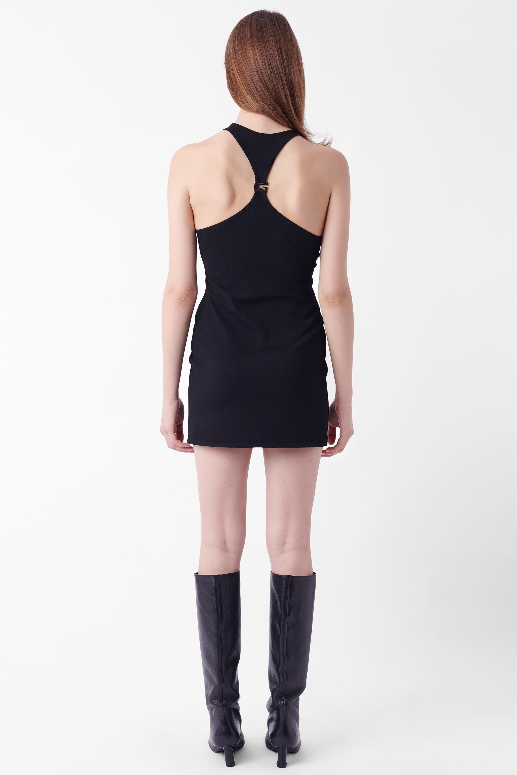 Tom Ford for Gucci Spring Summer 1998 racerback mini dress. Features racerback detailing with dark Gucci hardware clasp in mini length. In excellent vintage condition.

Brand: Gucci
Size: UK 8
Color: Black
Label size: IT 38
Modern size: UK: 8, US: