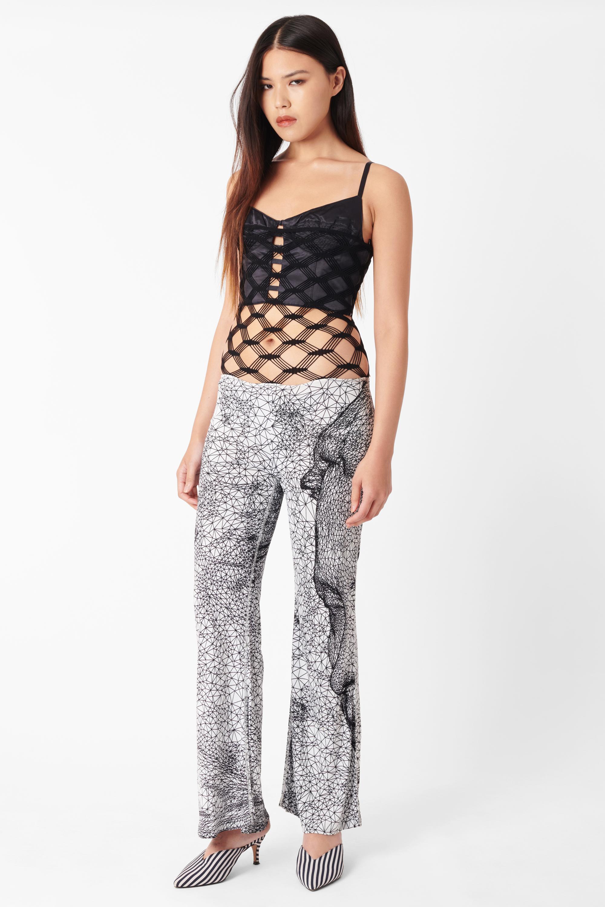 Vintage Jean Paul Gaultier Spring Summer 2001 trouser jumpsuit. Features iconic constellations print all over in straight legs, stretch fishnet body which can be worn around the waistline or pulled up over bust all have high stretch fabric. In