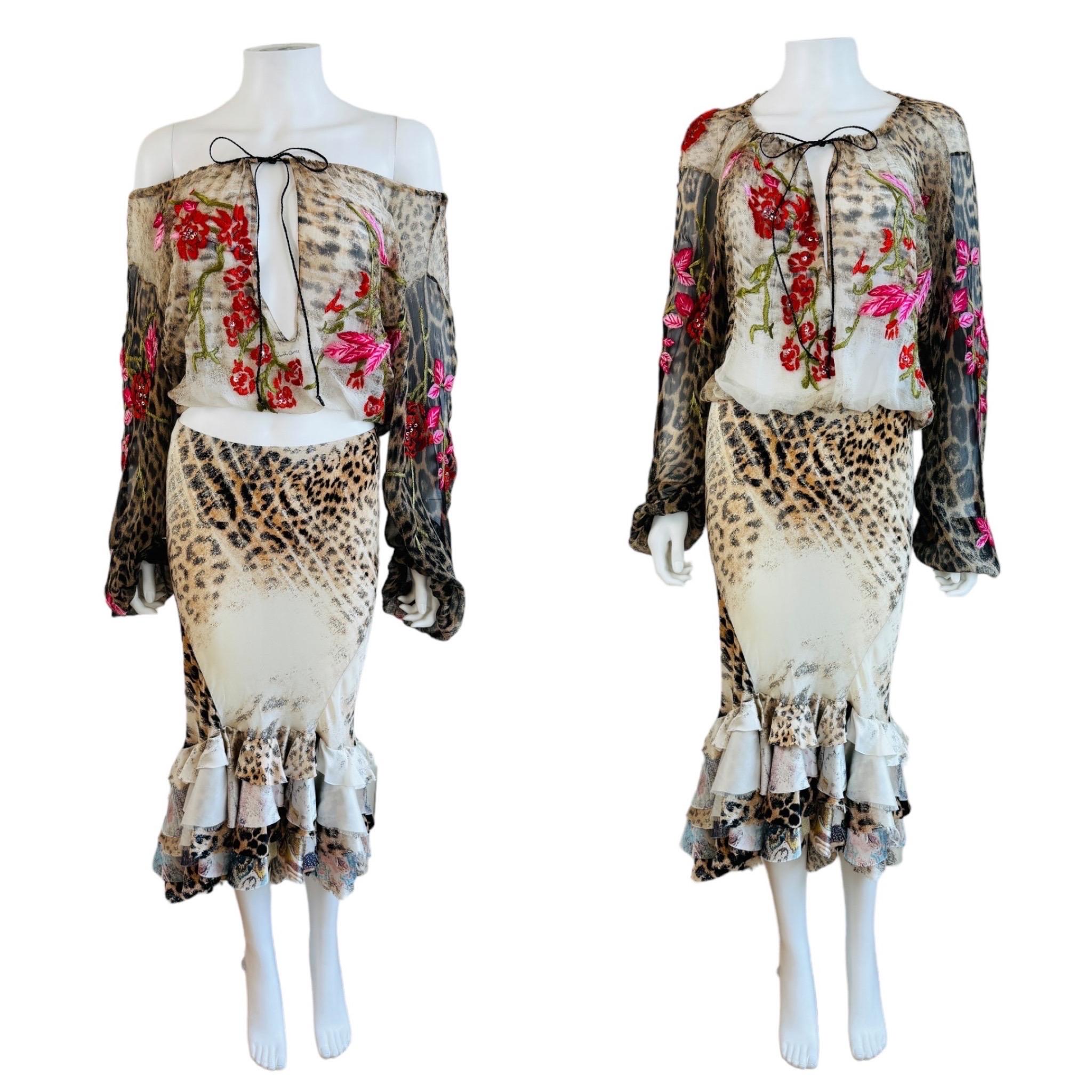 Vintage S/S 2002 Roberto Cavalli Set similar to one worn on the runway
Semi sheer leopard animal print silk top with embroidered flowers + beading throughout
Elastic at the neckline, wrists + hem
Ties at the neck with elongated low cut keyhole cut