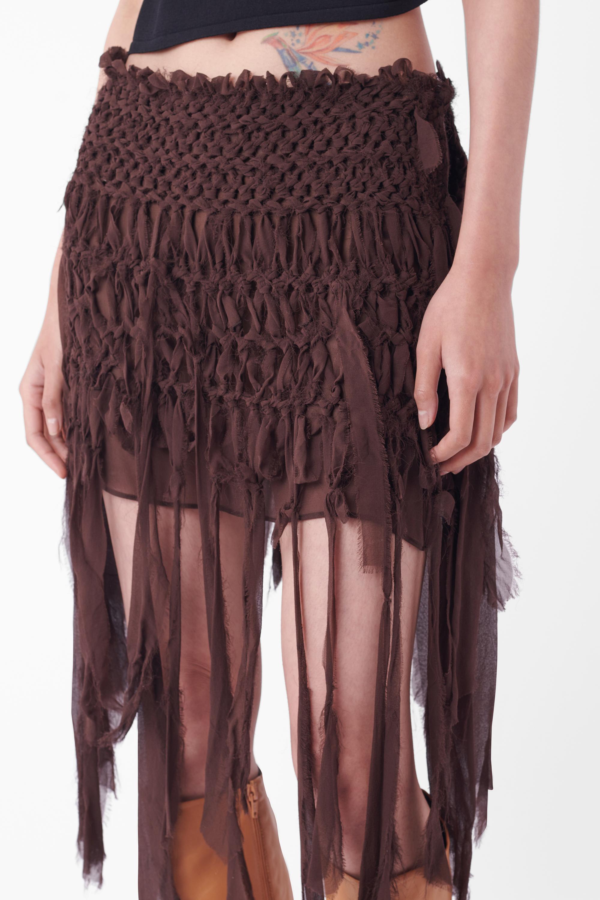 We are excited to present this Tom Ford for Yves Saint Laurent Spring Summer 2002 mombasa silk safari skirt, as seen on the runway - look 33. Features invisible side zip closure, sheer under layer with woven silk overlay and fringe. In great vintage