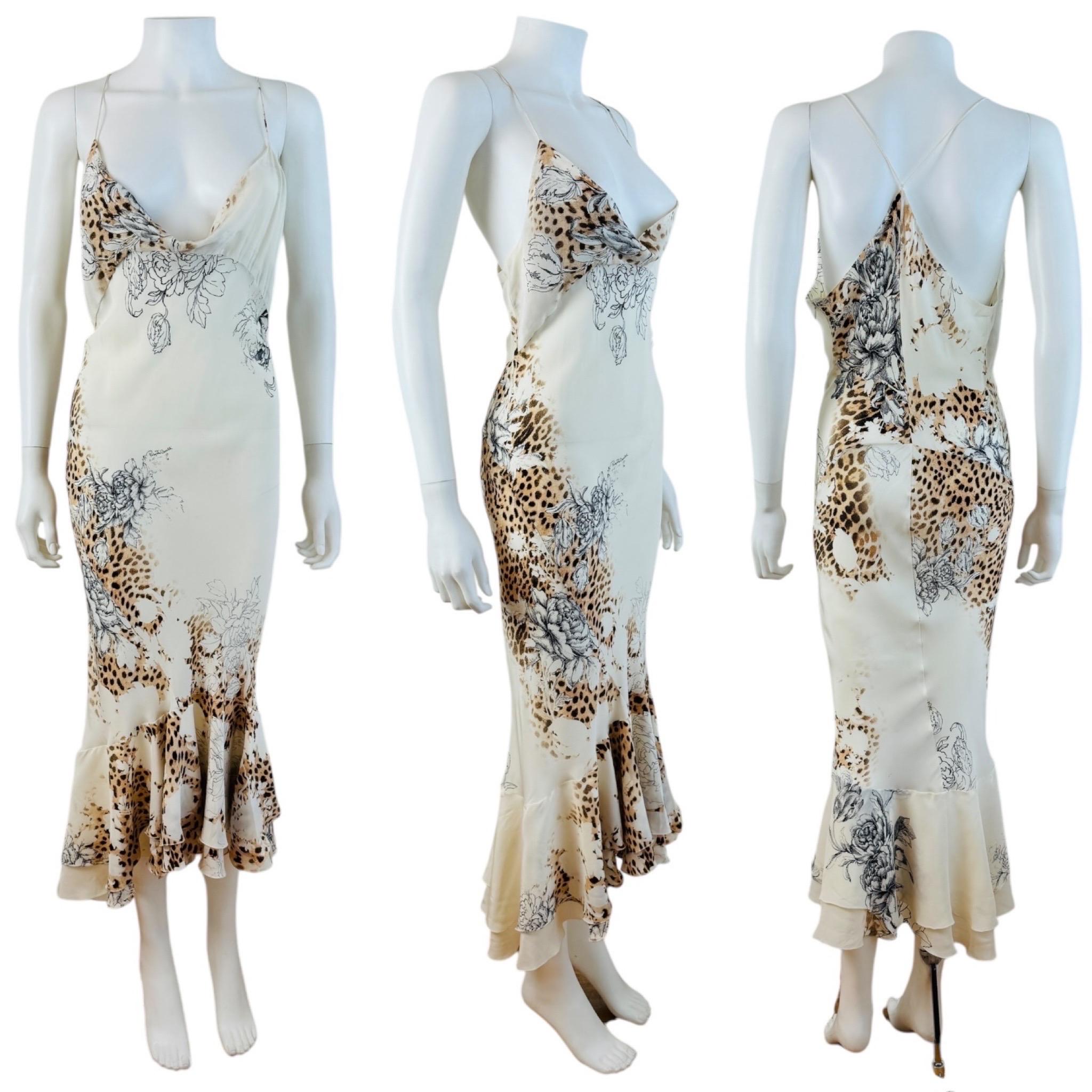 Stunning S/S 2003 Roberto Cavalli Dress
Off white silk fabric with roses + cheetah + leopard animal print
Draped neckline
Thin shoulder straps
Bias cut slip style
Midi length
Double layered flared hemline
Unlined
Hidden zipper up the left