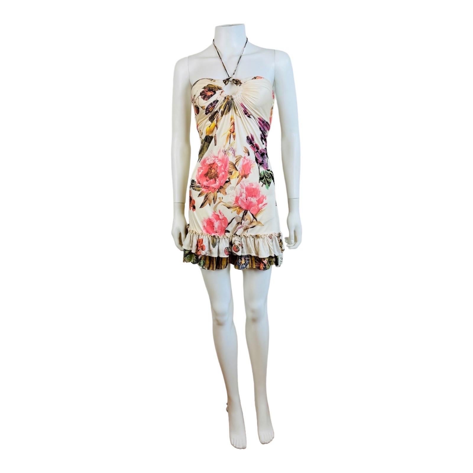Beautiful S/S 2005 Roberto Cavalli Dress
Slinky knit silk fabric with oversized floral + tiger print
Halter neckline with gold tone snake medallion at the bust + ties that tie behind the neck
Keyhole cut out at the bust
Sleeveless
Gathered details