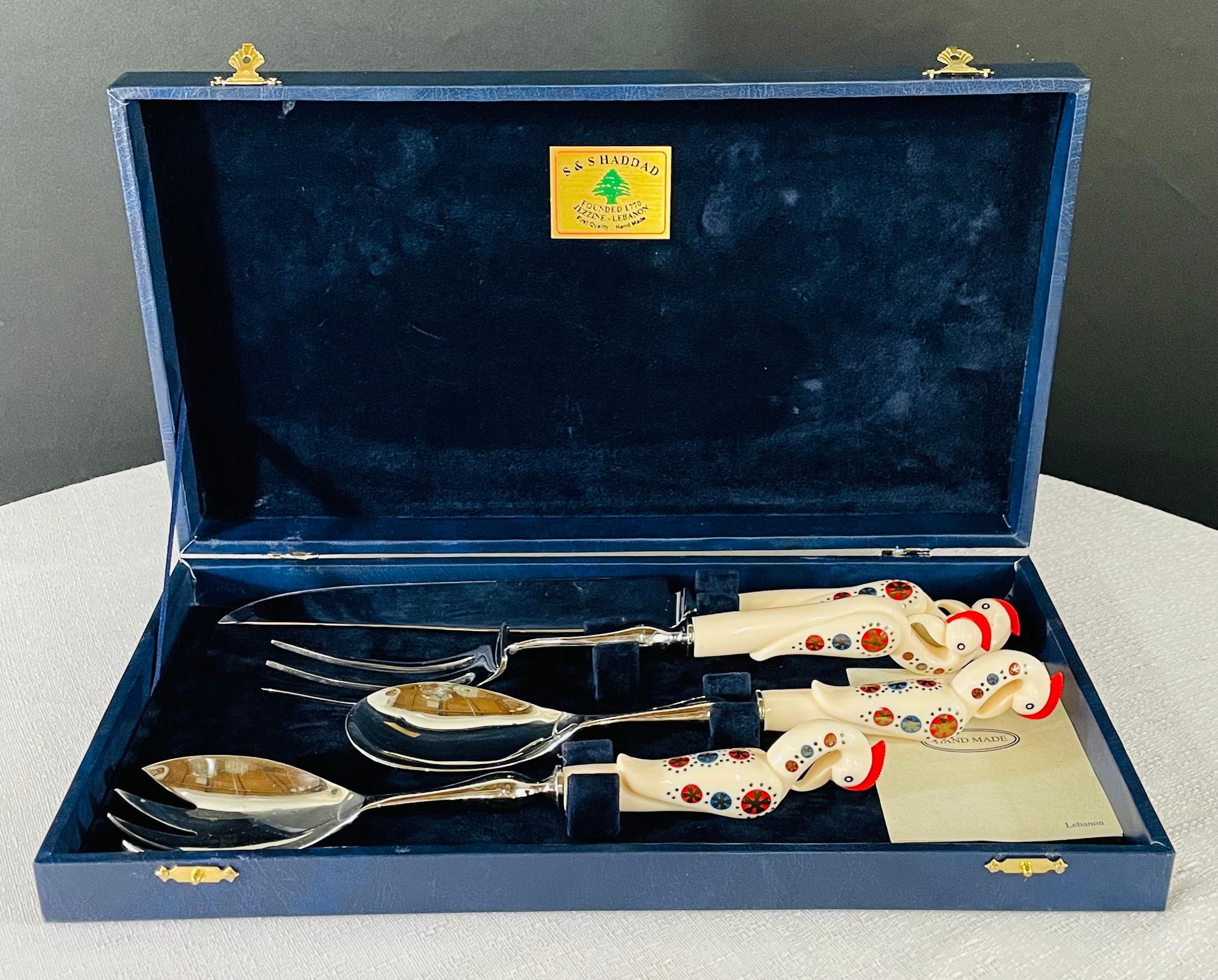 A classy vintage S & S Haddad Jezzine traditional cutlery or carving set , handmade in Lebanon of bone in Haddad iconic bird design. The set of pieces comes in it is original blue box and a certificate of authenticity. 

The set is made in