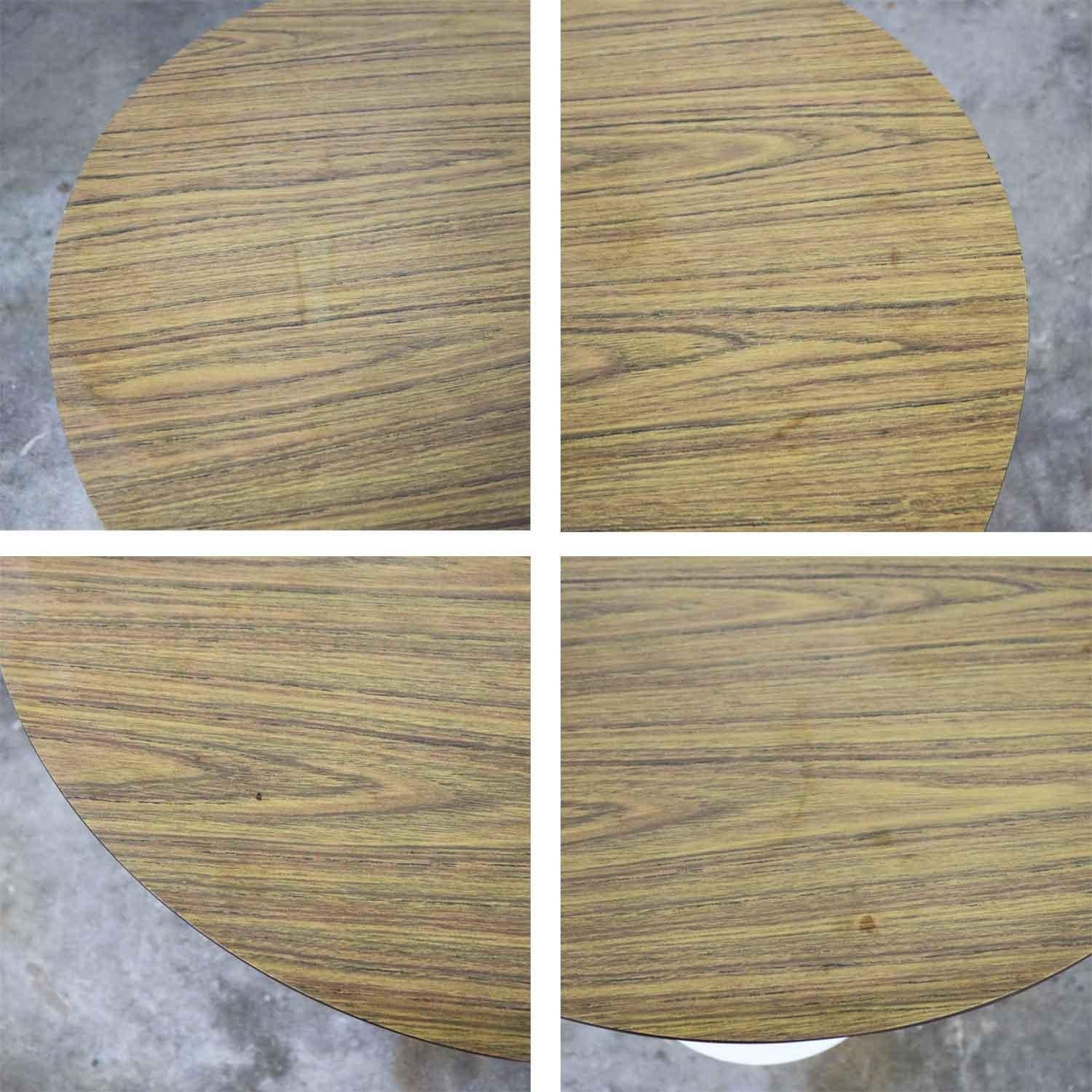 Classic Mid-Century Modern vintage tulip base table with a light woodgrain laminate top. In the style of Saarinen. This is possibly a Burke table, but it is unmarked. This one is a little shorter than dining height. In wonderful condition. The base