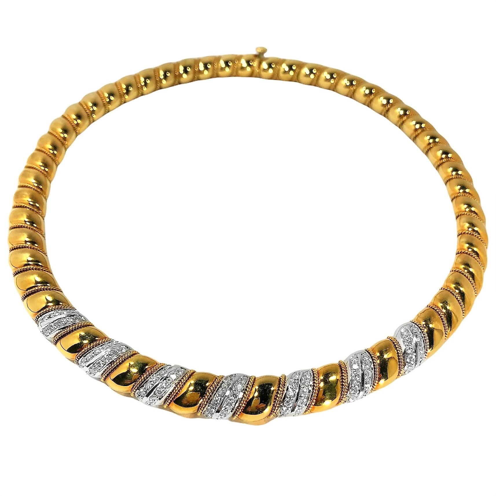 Crafted from 18k white and yellow gold during the late-20th century, this exquisite Sabbadini necklace has the rich patina of age. Each slightly puffed link from front to back is edged with a delicate line of 18k rope, and seven white gold links at