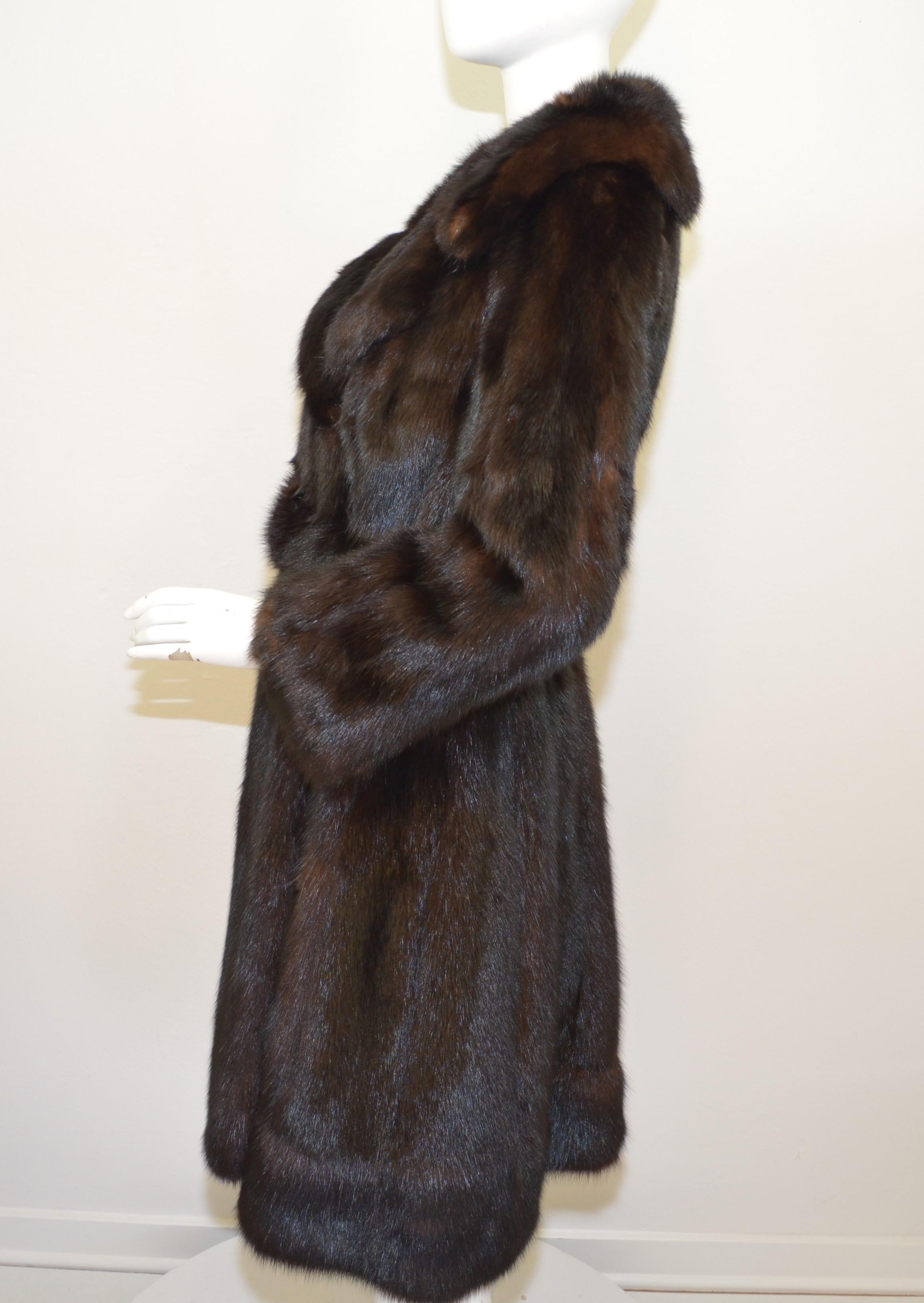 Vintage Sable Fur Belted Coat -- brown sable fur coat features a large collar with a belted closure. Coat has an embroidered design to the lining as pictured. Coat is in excellent condition with no flaws to be mentioned.

Measurements:
Bust