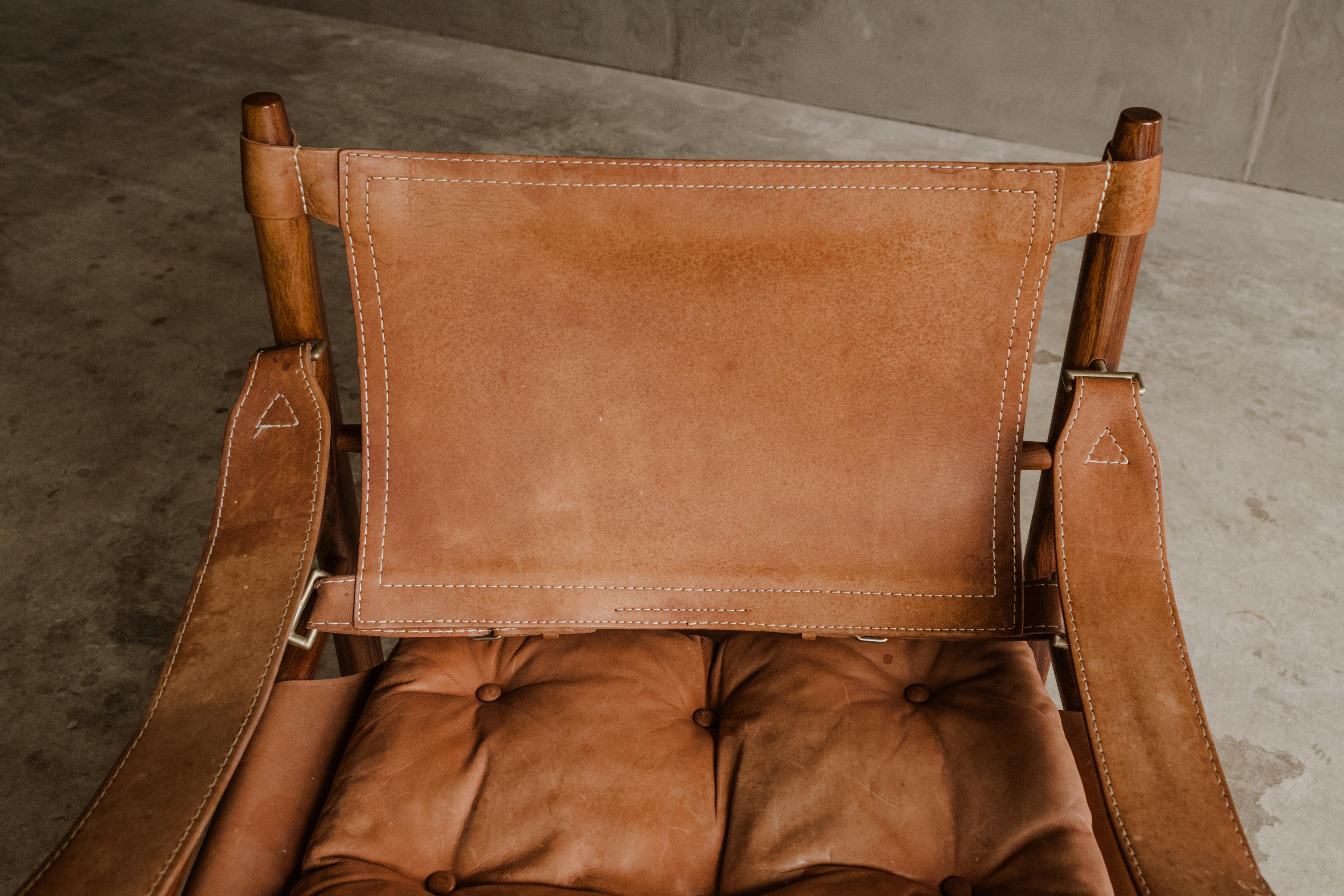 Vintage safari chair designed by Arne Norell, Sweden Circa 1970. Original Leather upholstery with nice wear and patina. Produced by Arne Norell AB, Aneby Sweden.
