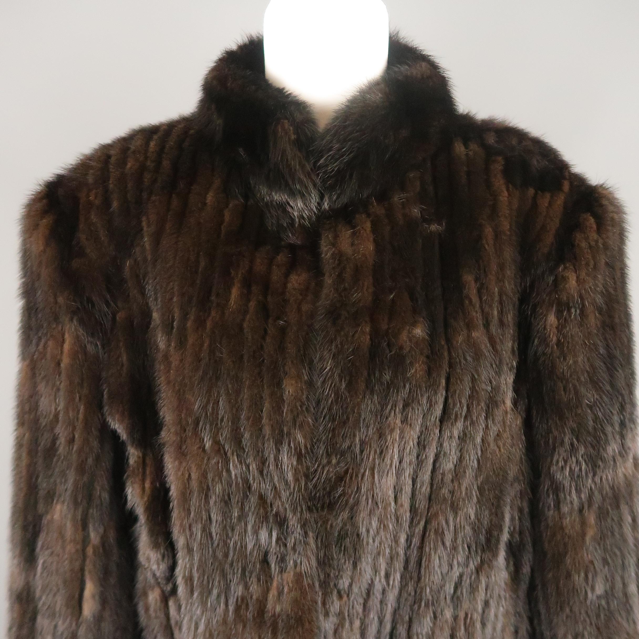 Vintage SAGA jacket comes in stripe textured mink fur with a stand up collar and hook eye closures.
 
Good Pre-Owned Condition.
Marked: L
 
Measurements:
 
Shoulder: 20 in.
Bust: 44 in.
Sleeve: 22 in.
Length: 26 in.