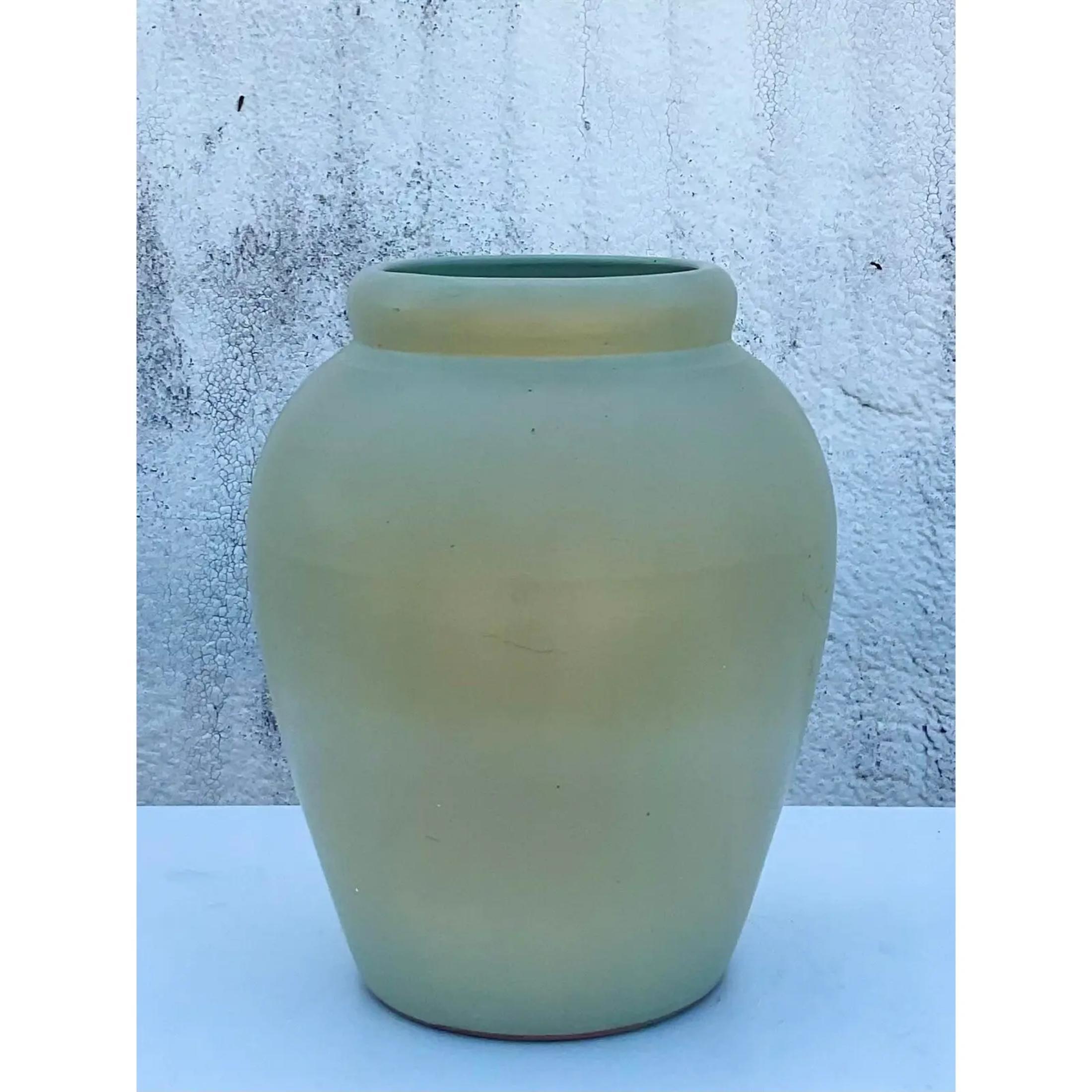 Vintage Contemporary ceramic urn. Beautiful matte glazed finish in a chic sage green color. Drilled for drainage. Part of a collection of urns that are also available on my Chairish page. Acquired from a Palm Beach estate
