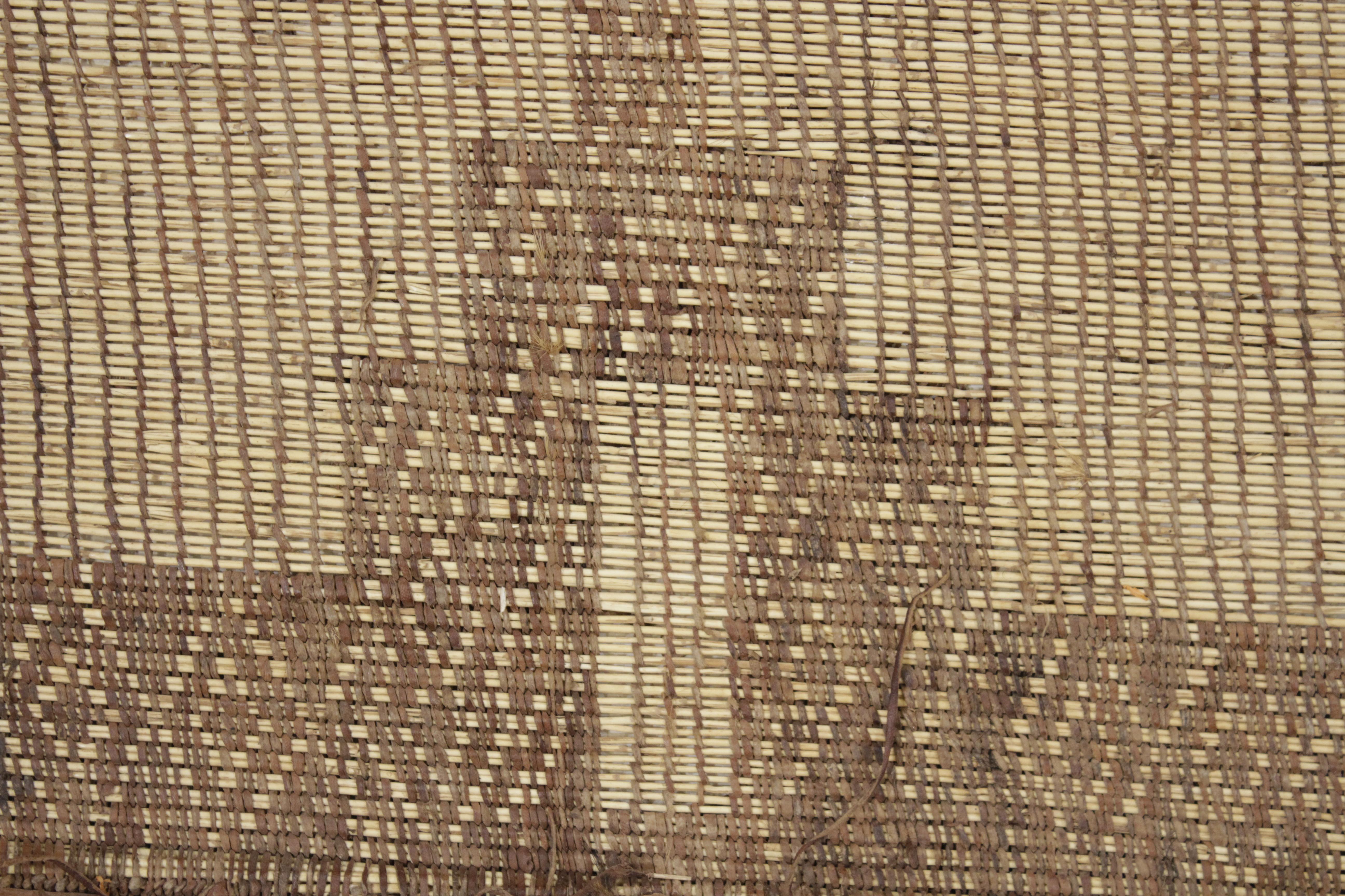 The carpets of the Tuareg, who are cattle herding nomads inhabiting a vast expanse of the Sahara desert, are among the most exciting group of weavings to appear on the market. These are woven by binding together fine straw reeds obtained from the