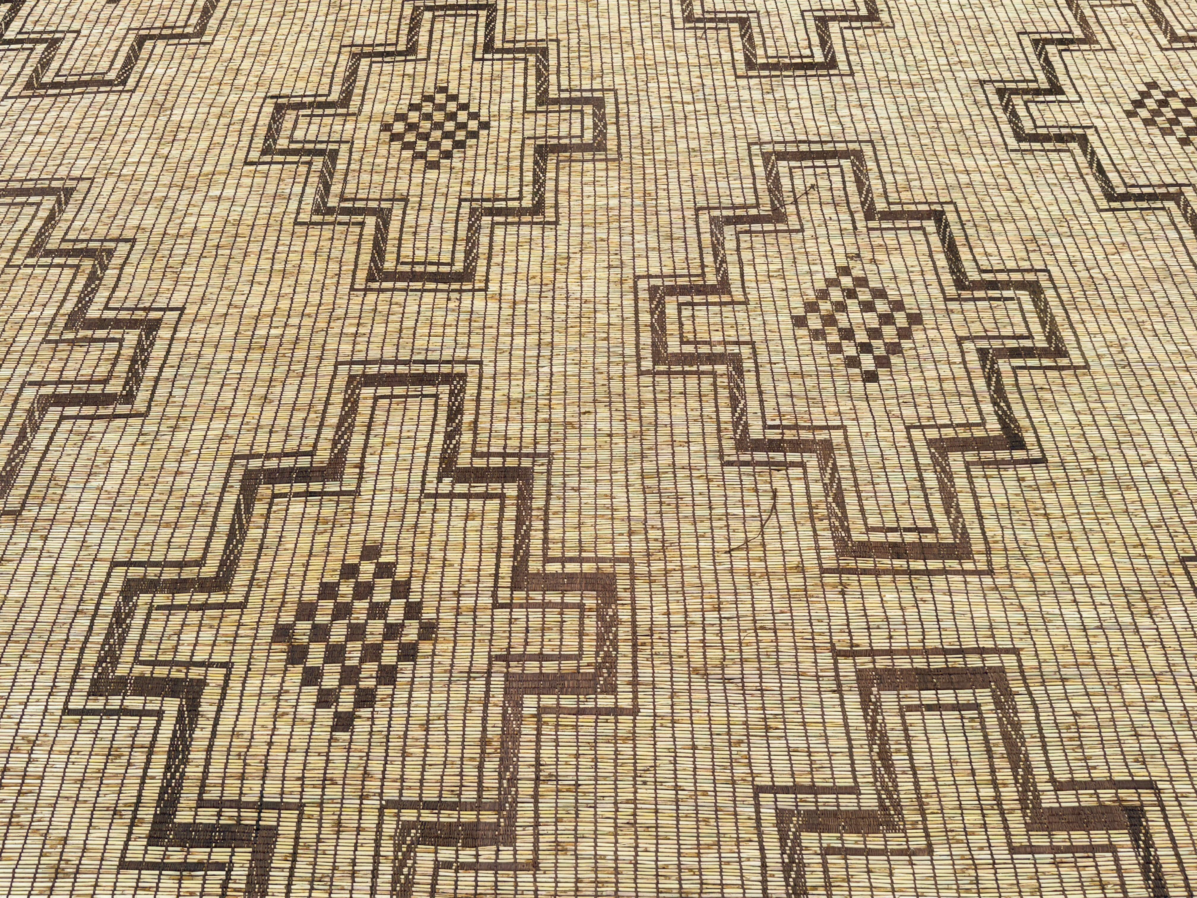The carpets of the Tuareg, who are cattle herding nomads inhabiting a vast expanse of the Sahara desert, are among the most exciting group of weavings to appear on the market. These are woven by binding together fine straw reeds, obtained from the