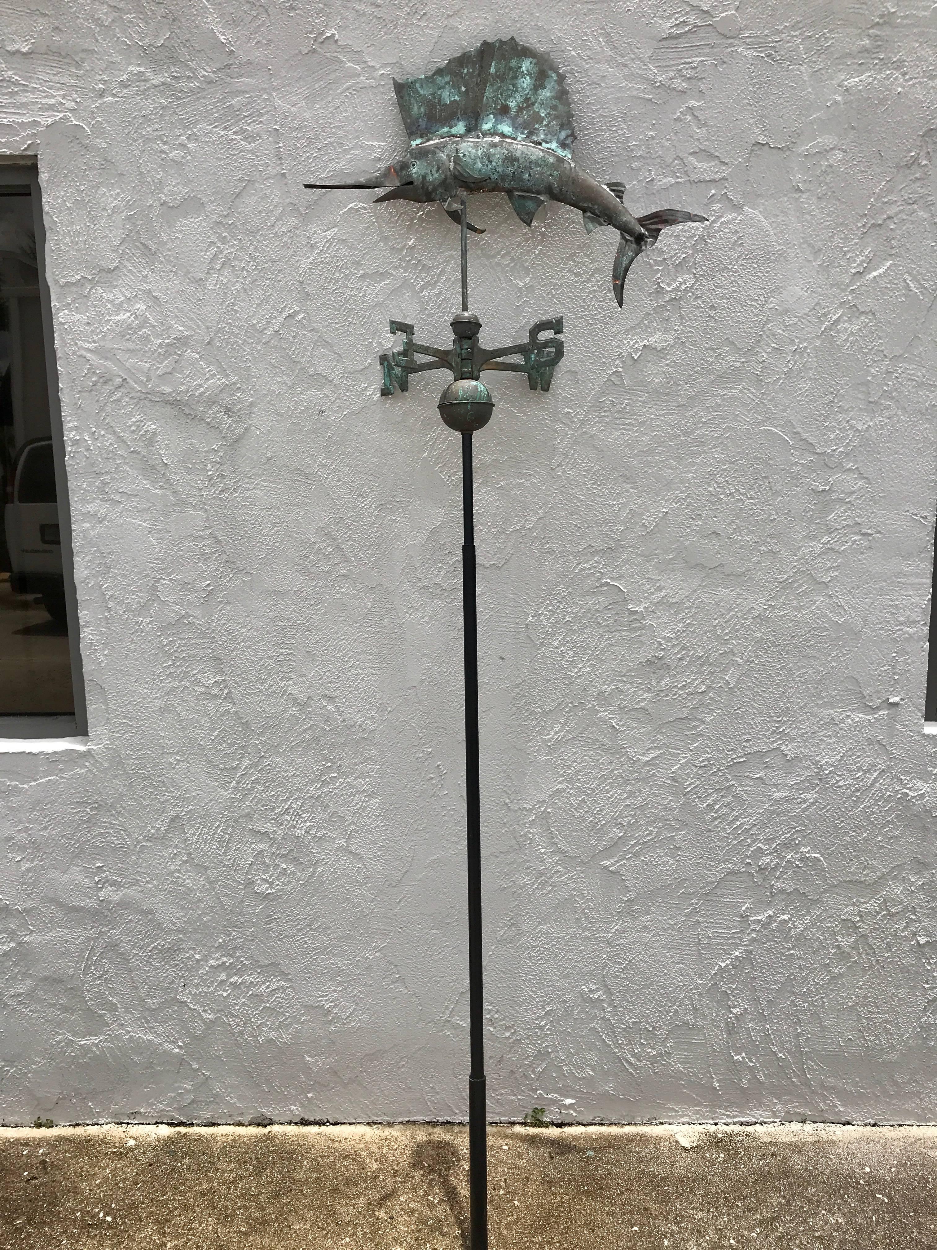 Vintage sailfish copper weather vane, finished on both sides raised on a iron pole, well sculpted, naturally distressed condition, structurally sound. Fresh from a Palm Beach Estate.