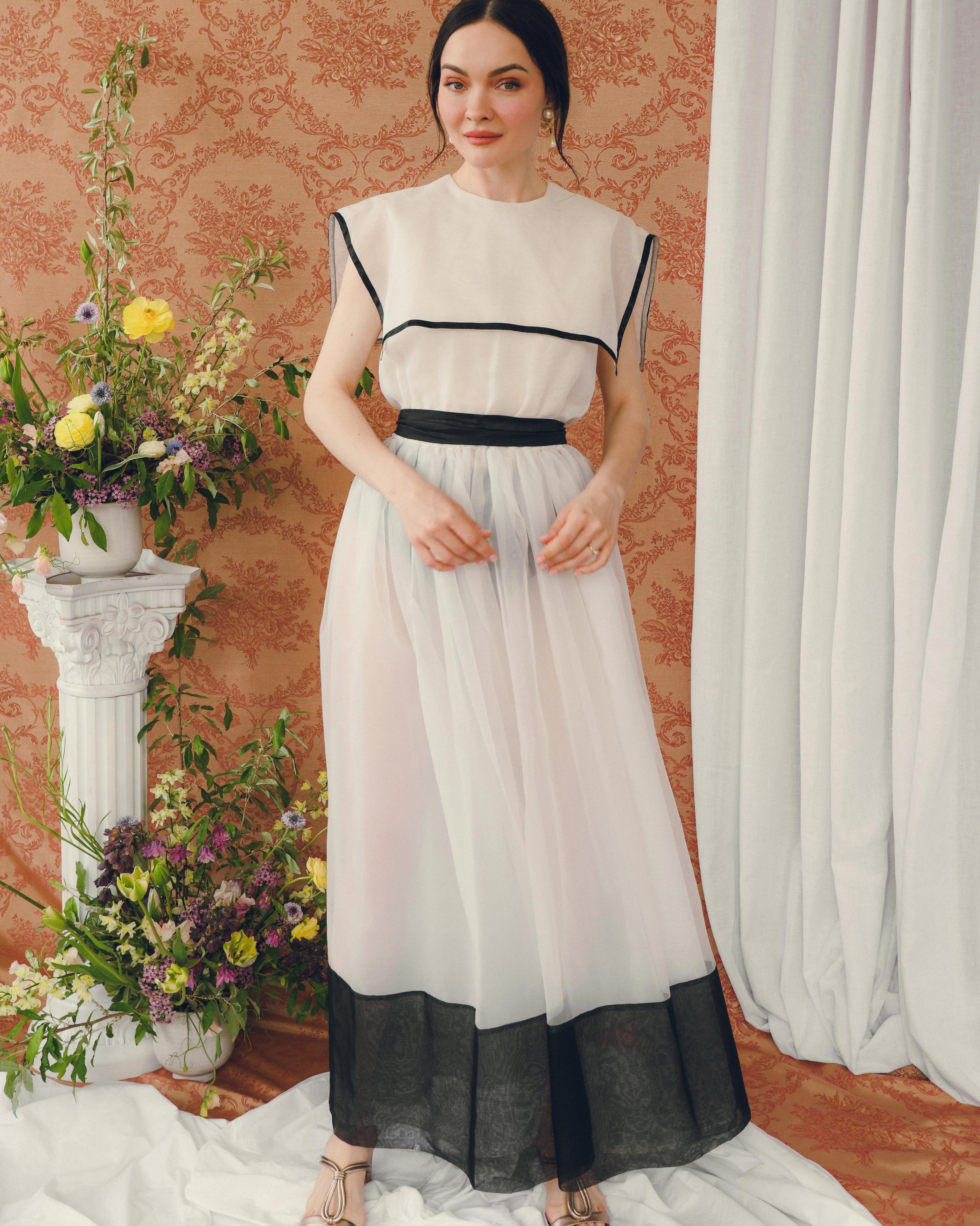 This romantic vintage dress is so unique for many reasons, beginning with the fact that the skirt's lining is detachable— it's shot without the lining and a contrasting brief for a very cool statement look but if you look at the last images, it's